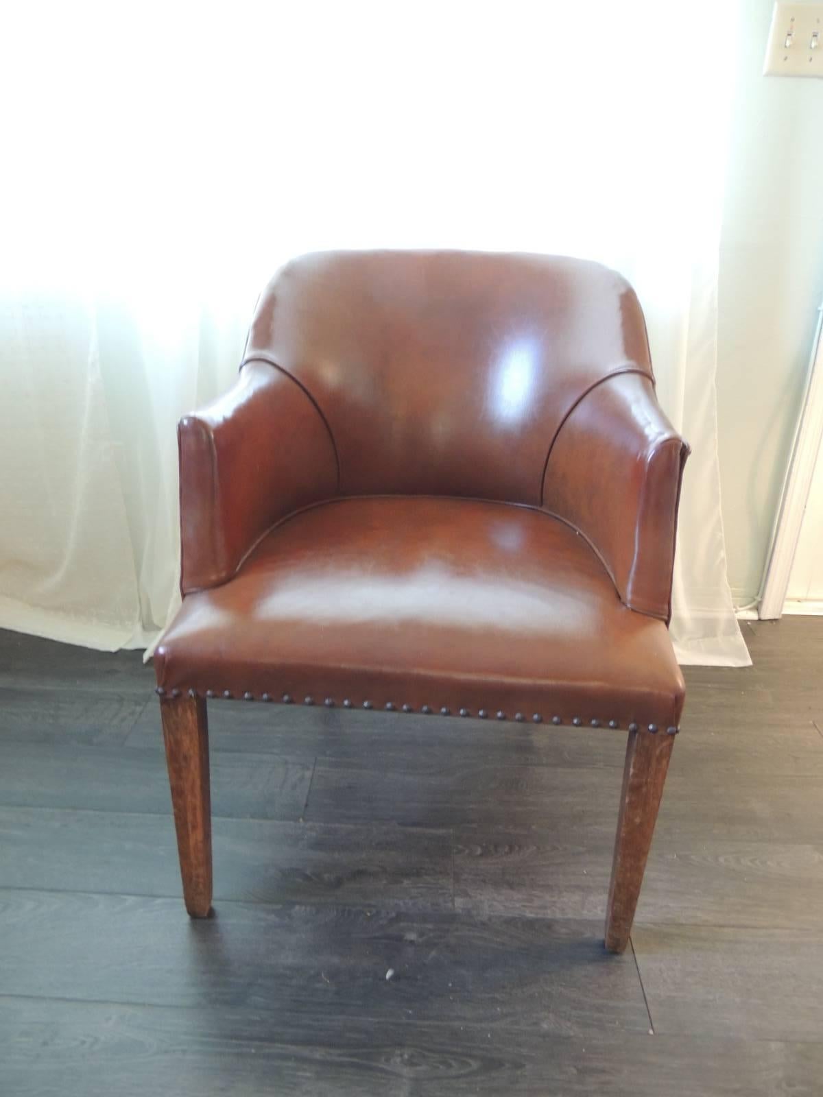 Original leather round back leather armchair with wood legs and original brass nailheads detail. Leather in excellent conditions, no tears. Deep brown color leather. Self welt.
Ideal for a library, desk, living room, bedroom, side chair or