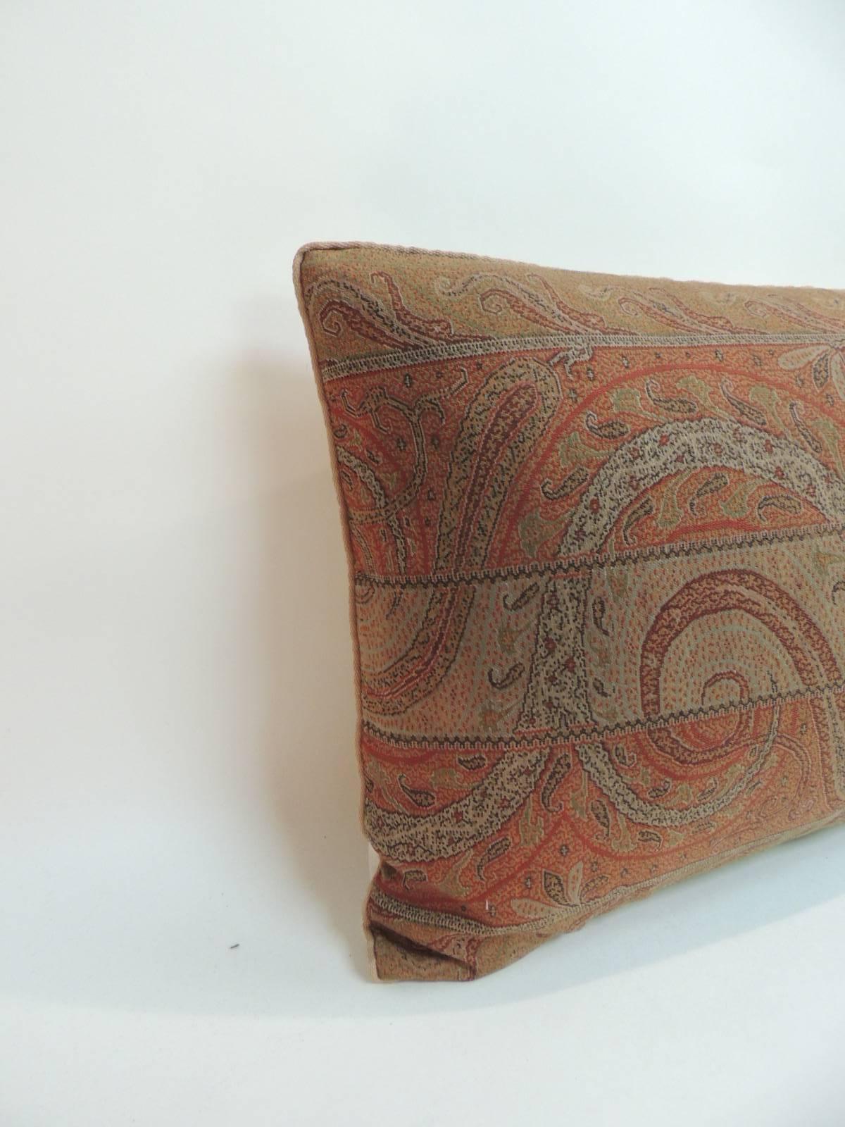Antique wool paisley Lumbar pillow, embellished with small tan rope trim all around and textured tan linen backing. In shades of green, red, brown, orange, brown, black and yellow.
Needle embroidery. handcrafted decorative pillow made with a textile