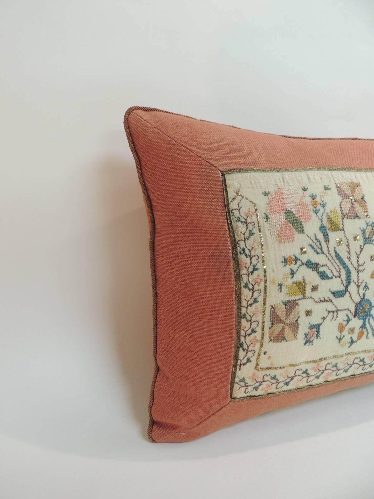 19th century Turkish embroidered linen and silk decorative lumbar pillow
Hand-made with a floral pattern embroidered silk on linen textile with gold metallic thread accents. Lumbar decorative pillow framed with an orange linen and orange trims.