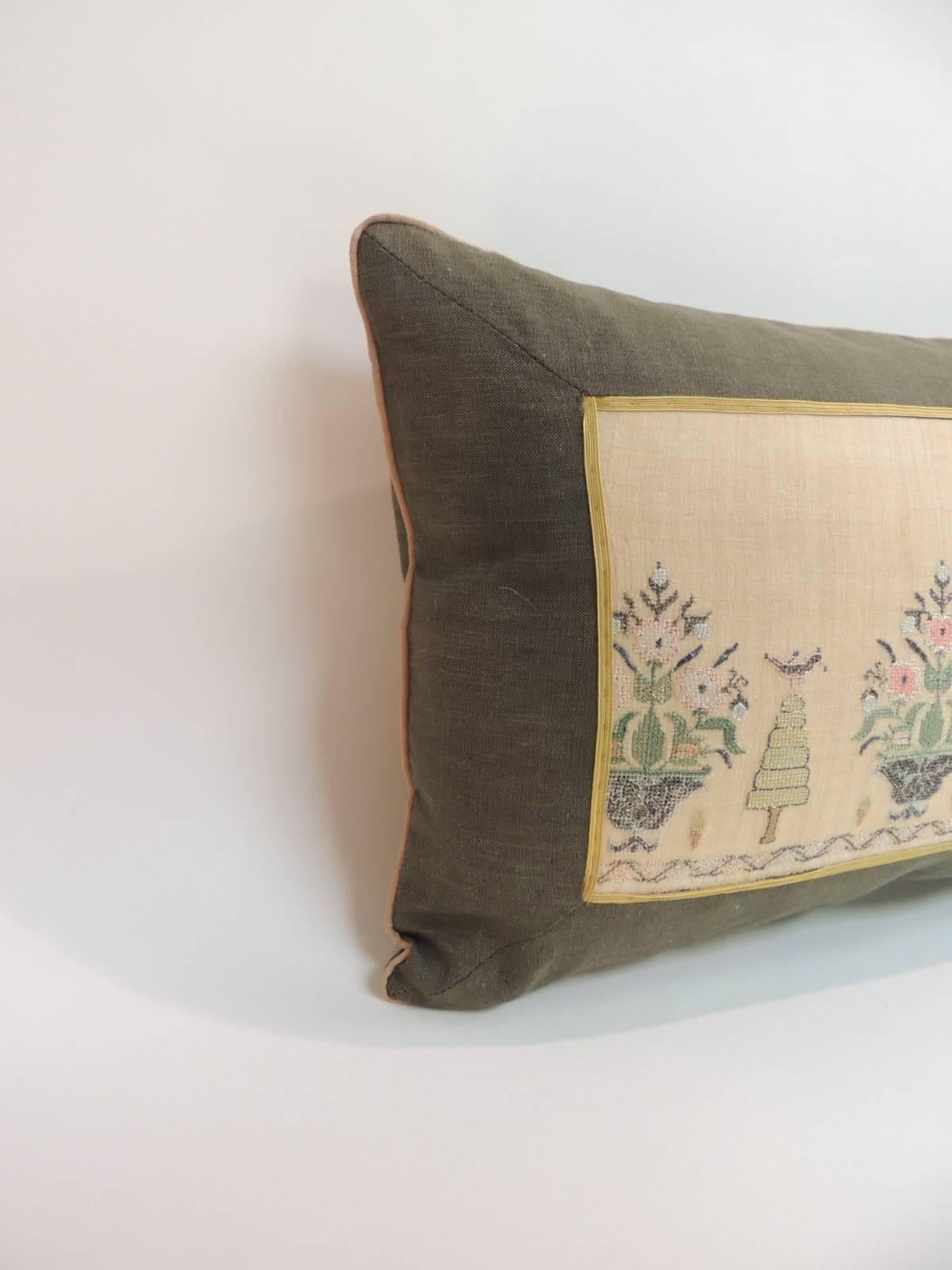 19th century Turkish embroidery lumbar pillow.
Turkish linen and silk embroidery lumbar pillow. Depicting flowers and trees, decorative gold trim across the linen frame. Green linen frame and backing. Small tan color rope trim all around.
Pillow