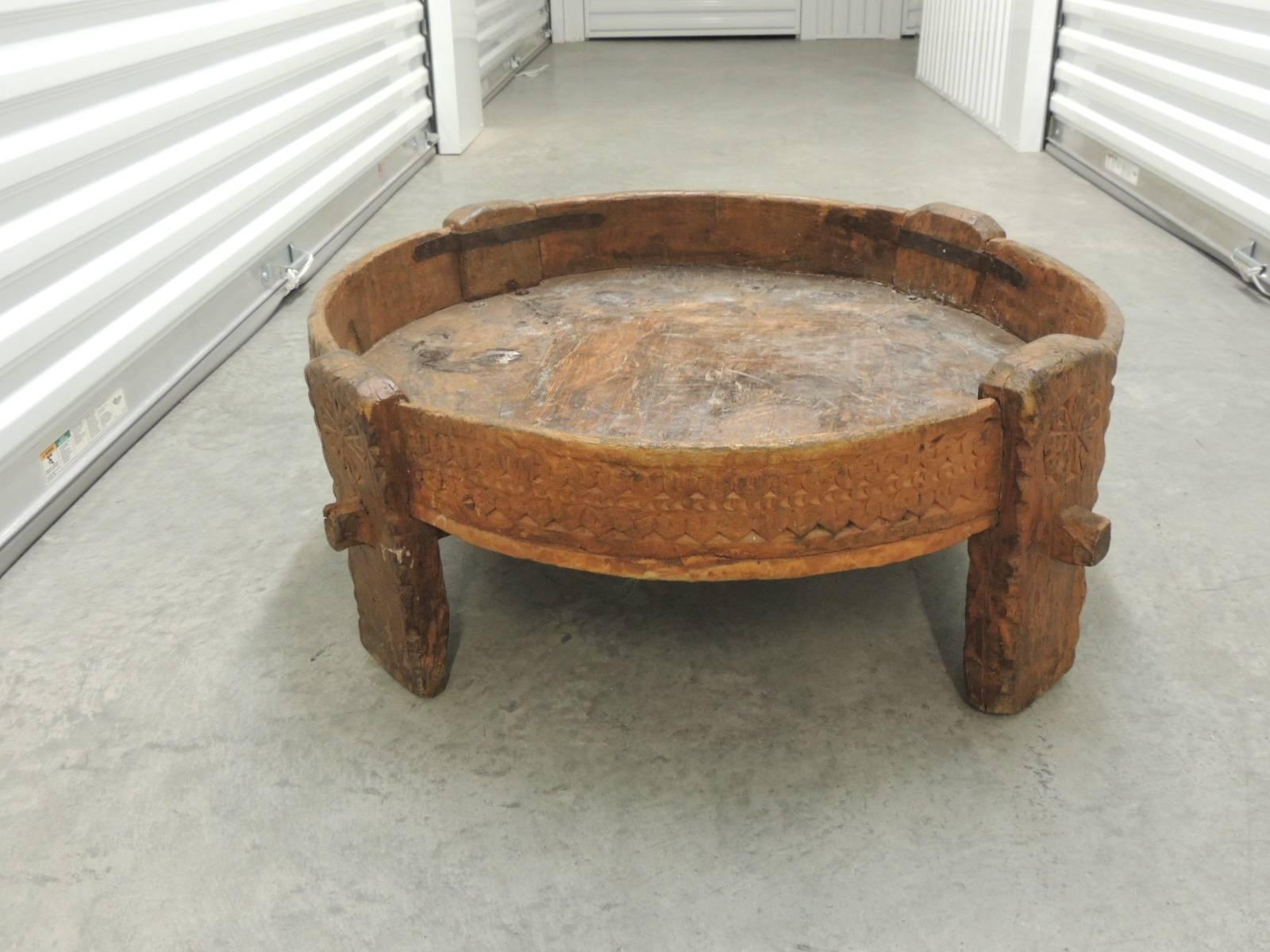 Offered by the Antique Textiles Galleries:
Moroccan carved wood Primitive vintage coffee table or ottoman.
Artisanal Moroccan carved wood Primitive coffee table. Handcrafted in the North of Africa with an inset. 
Size: 32 D x 11.5 H
Size of the