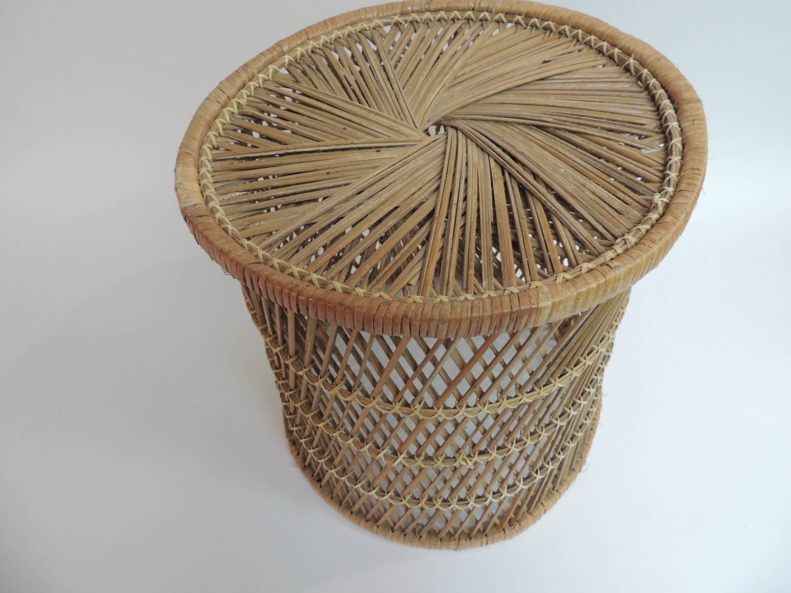 Offered by the Antique Textiles Galleries:
Vintage small round rattan side table
Rattan vintage small round side table with intricate woven design different in the top and the sides.
Size: 14 D x 15.5” H.

 