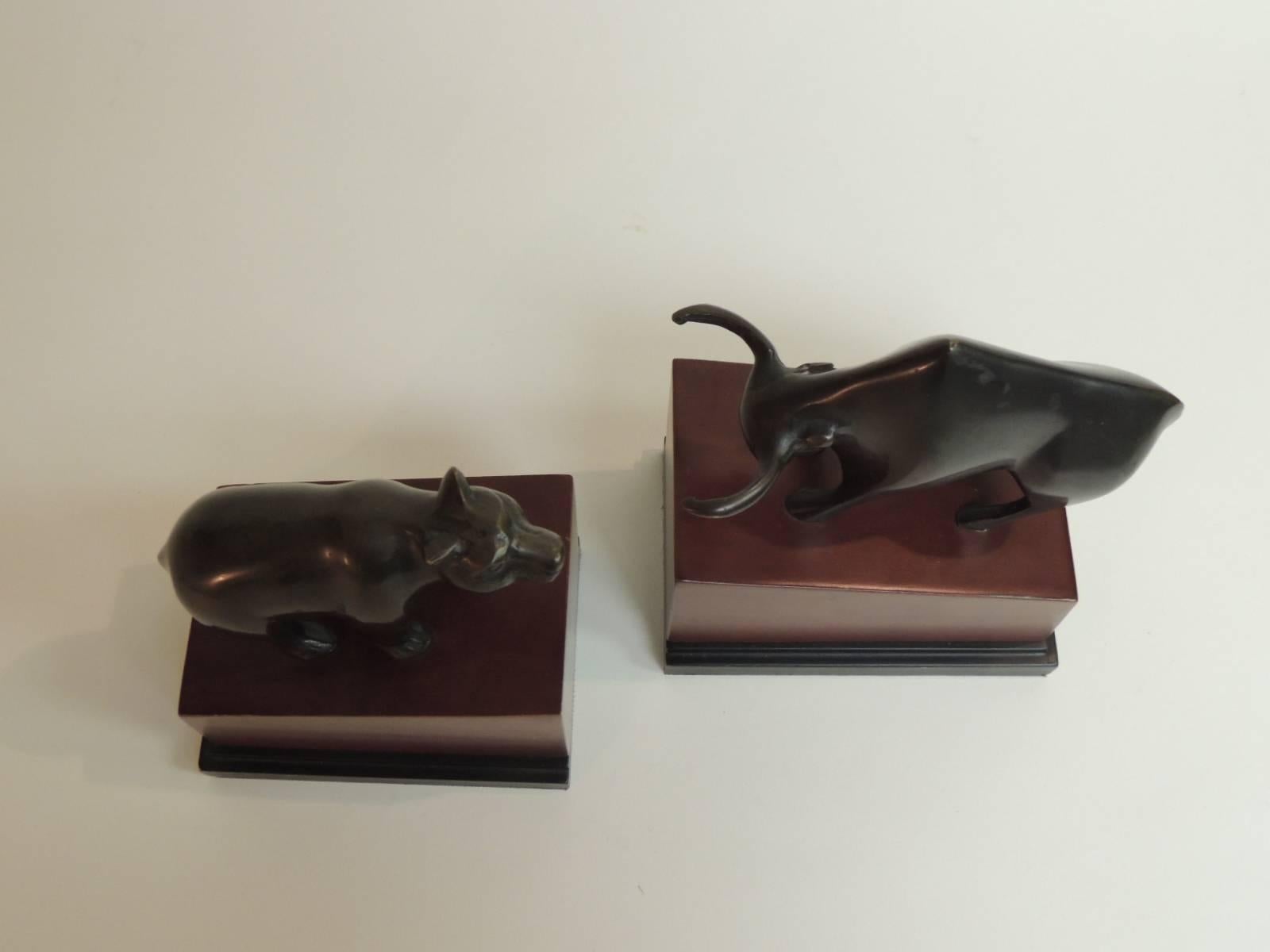 Pair of vintage bull and bear bookends crafted in bronze and mounted on wood bases, Italy, circa 1950s.
Size: 6” x 4” x 7” H.

 
