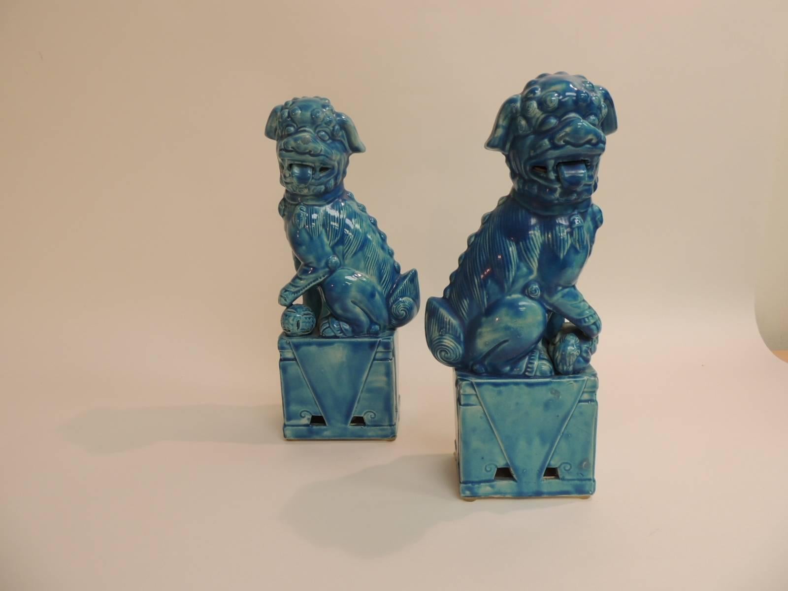 Offered by the Antique Textiles Galleries:
Pair of Vintage Ceramic Turquoise Foo Dog on Stand
Komainu: The History of Japan's Mythical Lion Dogs On your roof, guarding your shrine, and kicking kaiju butt. ... They are variously known in English as