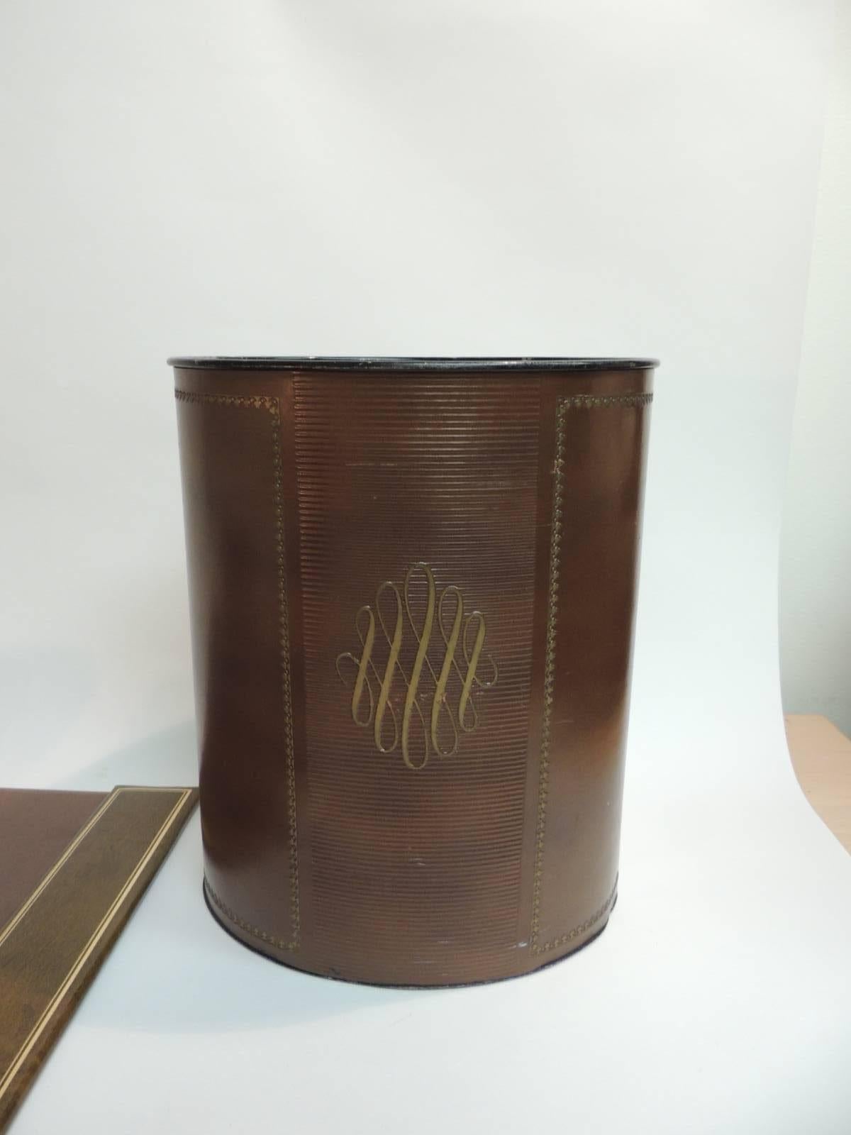 Offered by the Antique Textiles Galleries:
Set of vintage embossed brown letter office desk set. Top grain cowhide brown leather embossed with gold leaf details. Set includes:
Pair of heavy bookends: 2.5 x 4 x 6H
Waste basket metal wrapped in