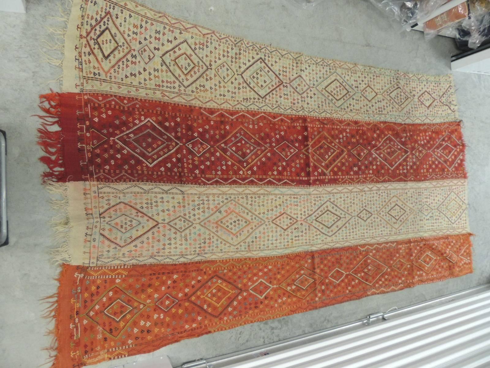 Turkish handwoven wall hanging textile with fringes. Large colorful textile with tribal pattern.
Woven strips of home-spun wool creates this amazing textile in shades of yellow, red, natural, orange, blue and black.
Could be use as a table cloth,