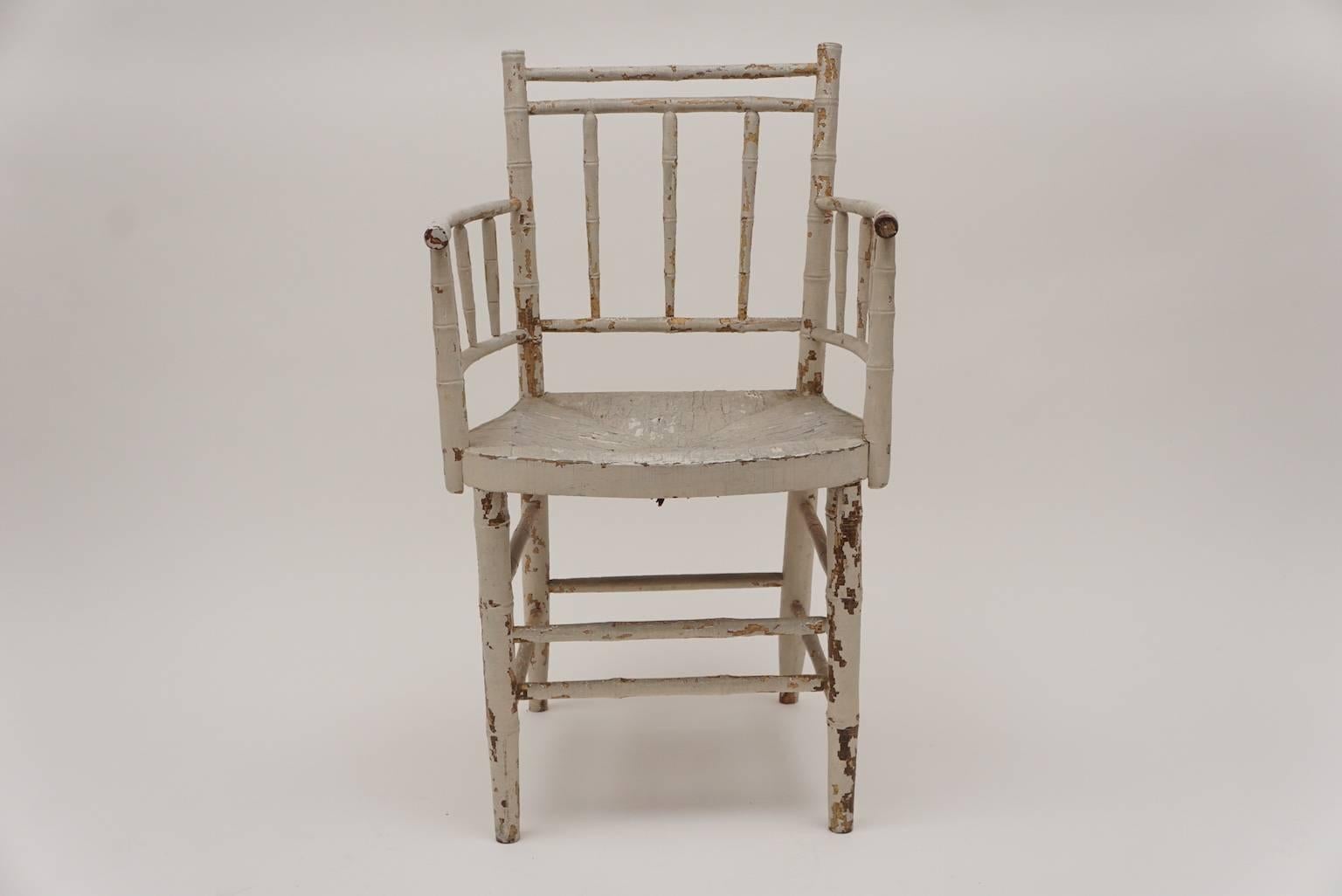 Charming off-white pearly-painted Federal armchair with painted rush seat.
