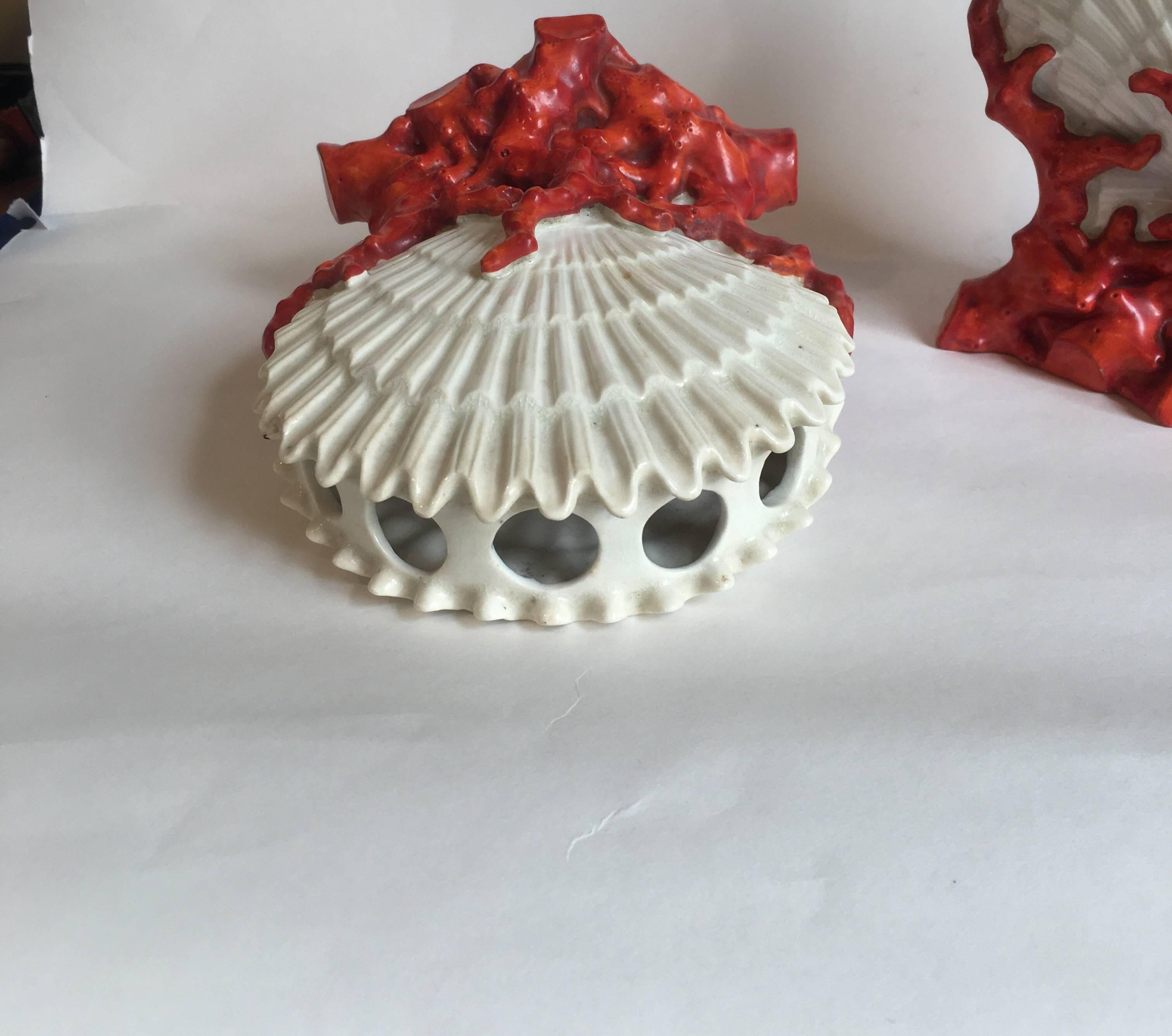 Pair of 19th century Staffordshire glazed porcelain shell and coral form bough pots together with a pair of similarly decorated English candlesticks. The bough pots bought at Christie's London, 1986 and the candlesticks from Philips London, 1990.