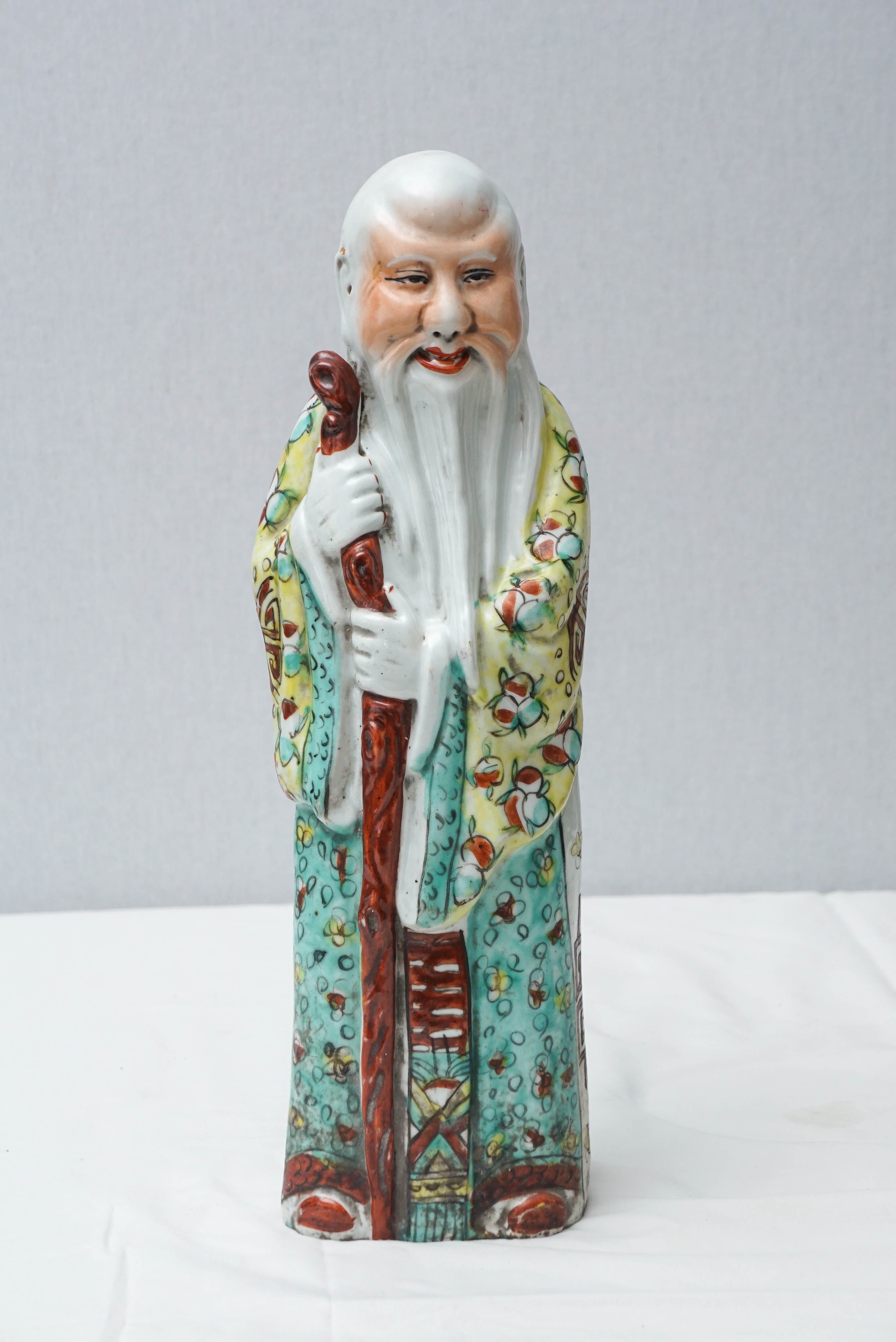 Three early 20th century Chinese god figures representing, prosperity, longevity and
happiness. The figure with a scepter representing wealth, the elderly man, long
life and the figure holding a child, happiness. Measurements below are