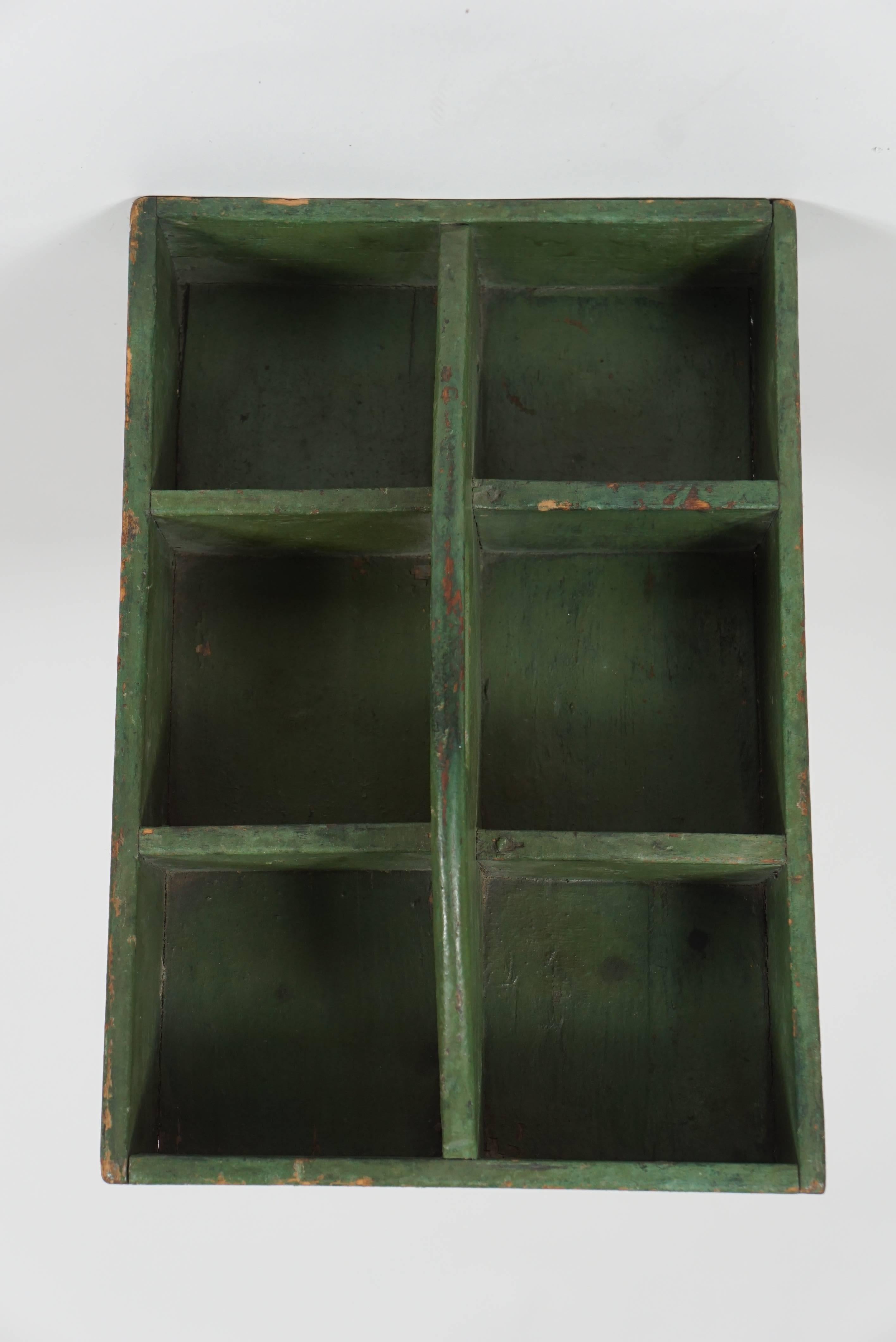 Small green hanging shelf, tool box. This is actually a tool box, but we loved
it as a hanging shelf and it has hooks for hanging it on the reverse side. American. Lovely for small objects, or keep your jewels in it.