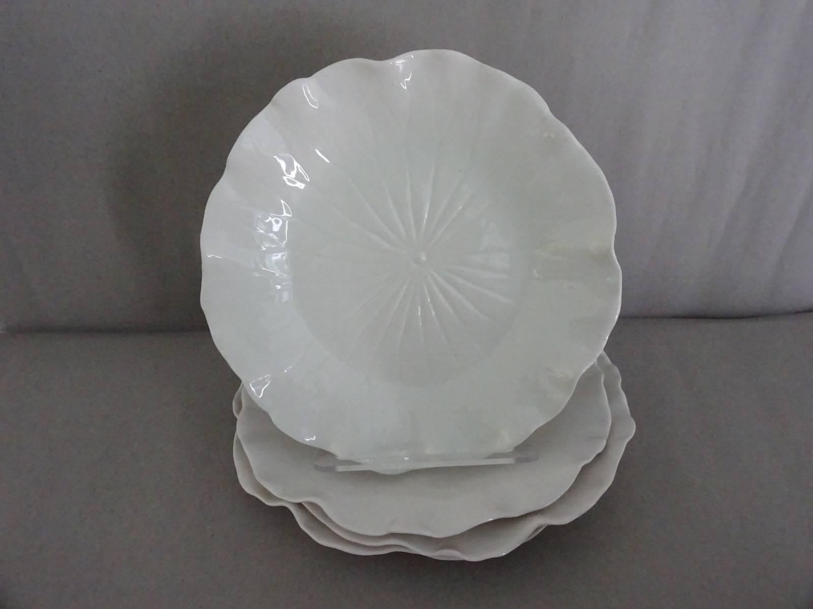 Set of ten (10) porcelain creamware lotus dessert or salad plates. No markings, but most probably modern. Probably English. Impressed porcelain to give
the feel of a real lotus leaf. Delicately made lovely thin porcelain.