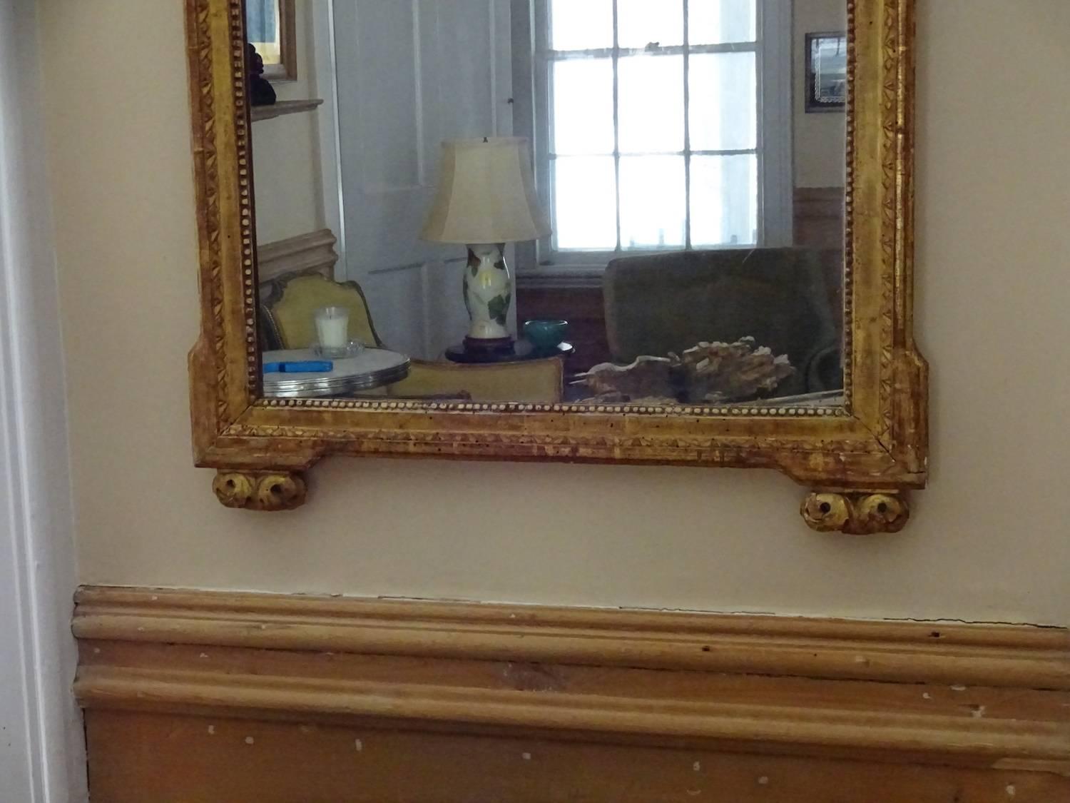 Handsome Louis XVI style giltwood rectangular mirror with bead and stylized
leaf tip borders. Nice size.