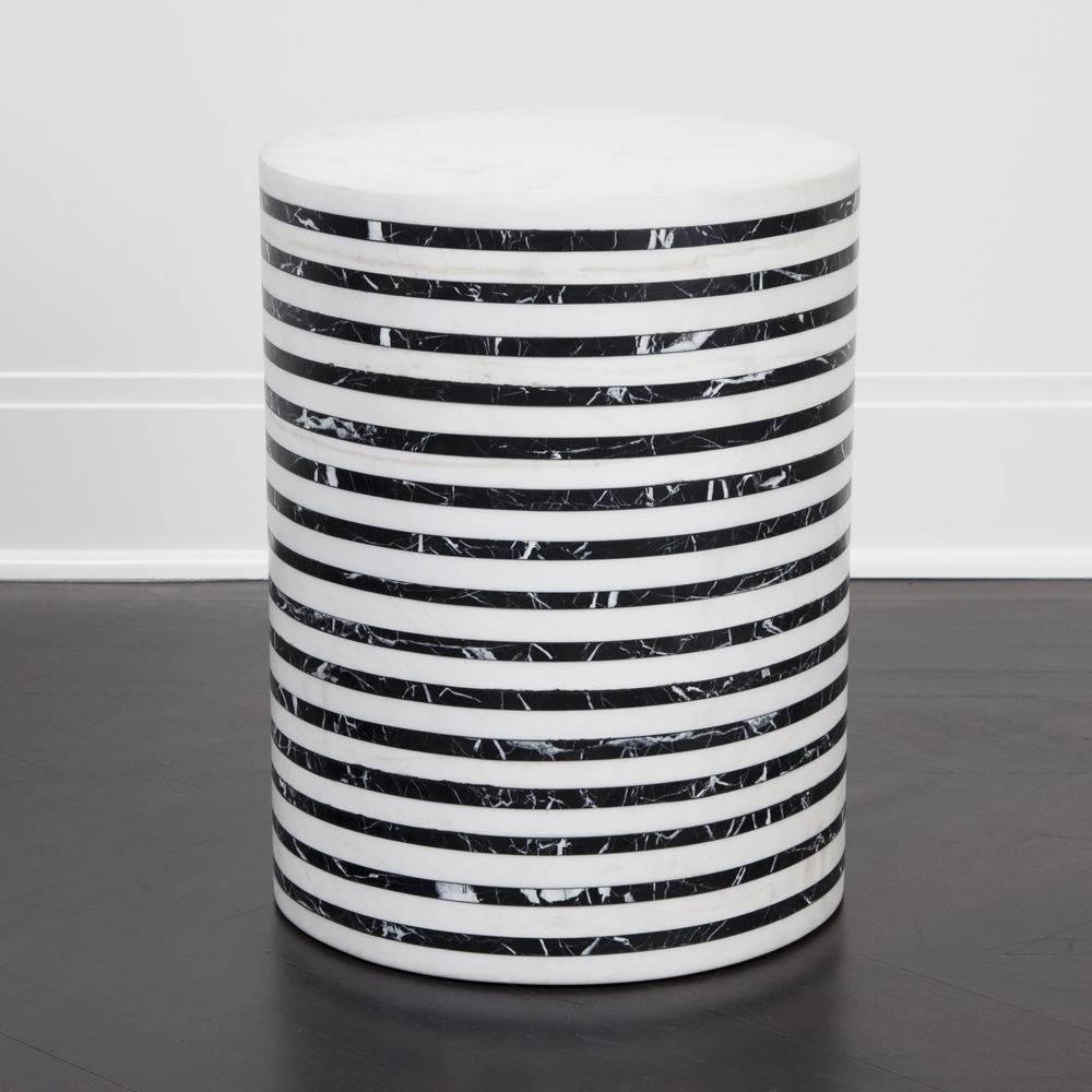 Inspired by Kelly’s love for exploring sculptural function and form in her favored black and white fine-striped pattern, this solid marble stool is made from natural, hand-carved marble. The bold lines of honed marble and the simple modern
