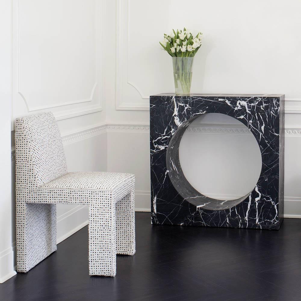 Carved from a solid piece of marble, the Selby console, is geometric and bold. This console perfectly compliments any setting with it's sculptural and modern vibe.