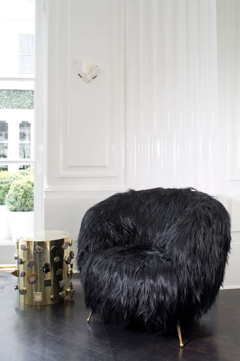 Silky black goat fur wraps the rounded silhouette of our classic Souffle chair for an extraordinarily elegant effect. Each hardwood frame is double-doweled and glued, with eight-way hand-tied springs. Plates of individually selected goat fur are