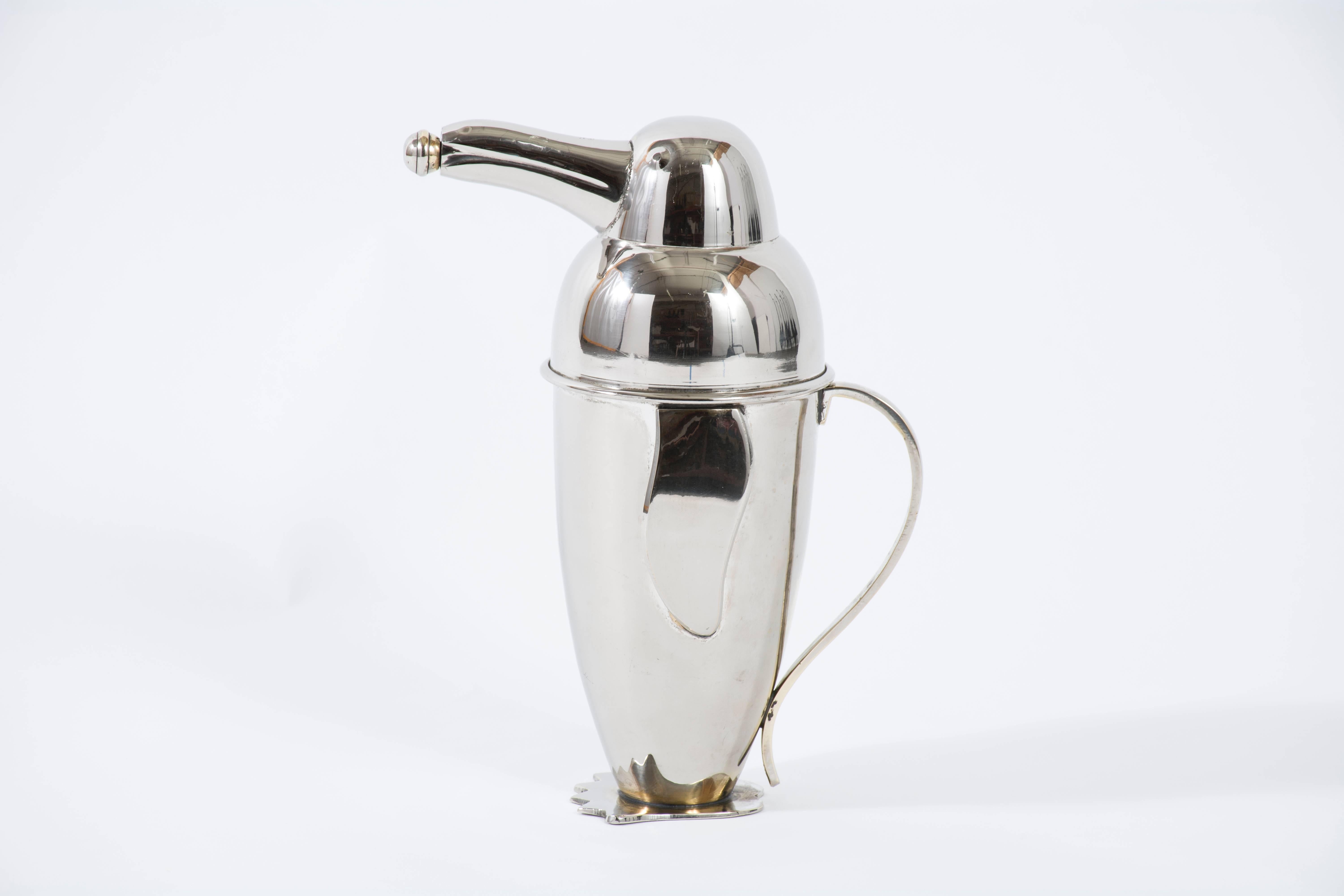 This is a vintage penguin cocktail shaker, circa 1950s. Nickel-plated.
 