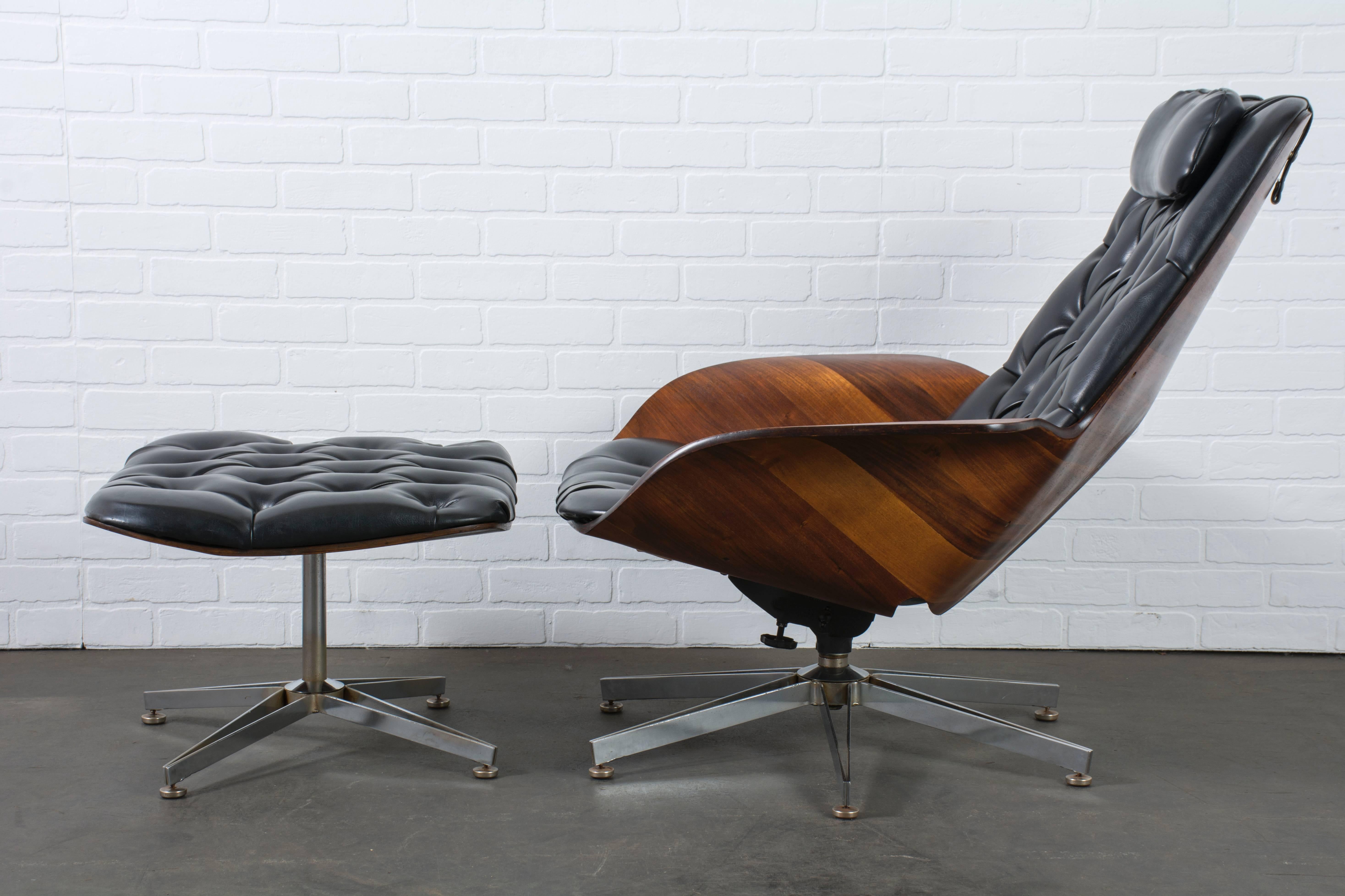 This Mid-Century Modern lounge chair and ottoman was designed by George Mulhauser for Plycraft in the 1950s. It features a molded plywood shell, the original tufted black Naugahyde upholstery, and a rare stainless steel 'star' base. This chair