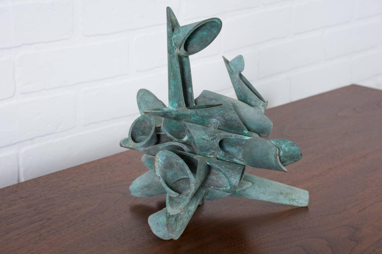 This is a vintage Mid-Century bronze abstract sculpture with a wonderful green patina.