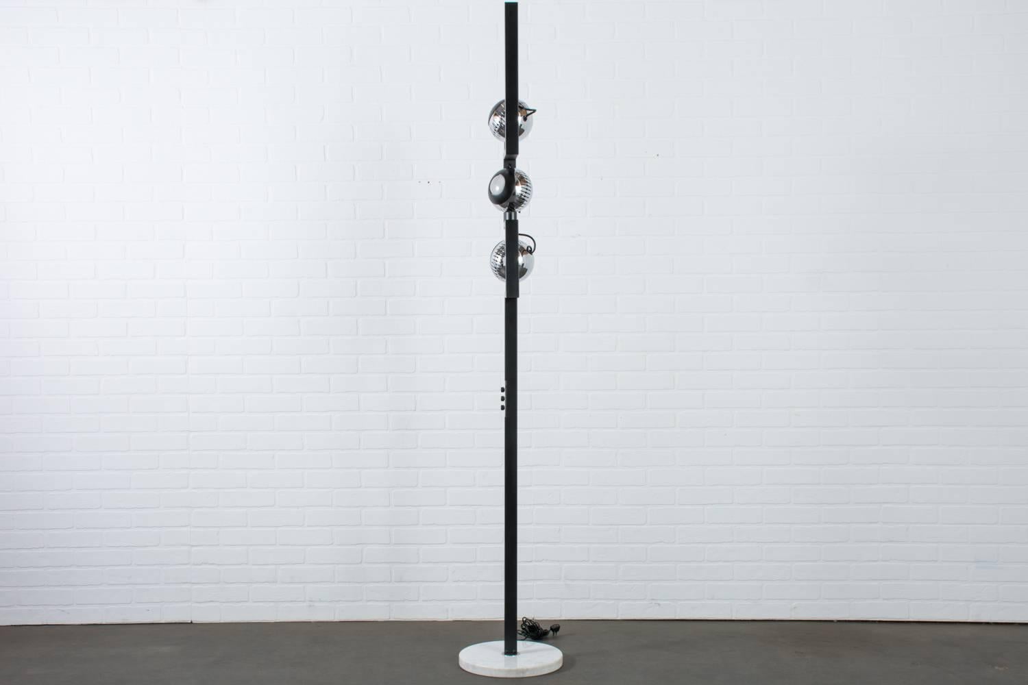 This vintage Mid-Century floor lamp was designed by Angelo Lelli for Arredoluce in the 1960s, Italy. Angelo Lelli started the lighting company, Arredoluce, in 1943 and it was active until the 1980s. The three chrome ball lights can be turned on