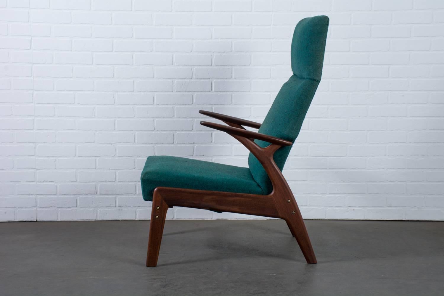 This vintage midcentury lounge chair was designed by Christian Sorensen for Gorm-Mobler, Denmark, circa 1960. It can be reclined and has an adjustable ottoman that pulls out from under the seat (which is cleverly hidden when not in use). The frame