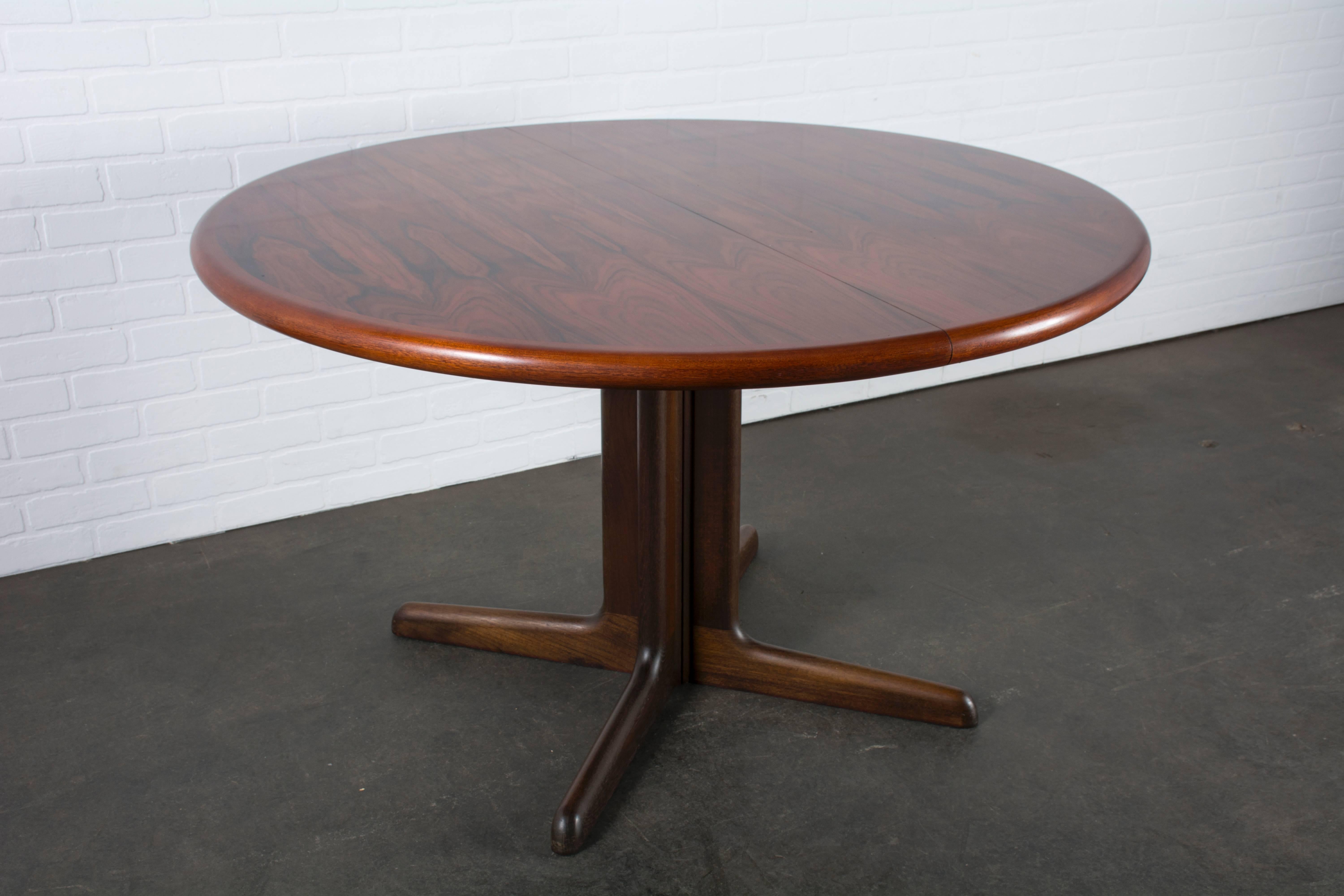 This vintage Mid-Century rosewood dining table was manufactured by Gudme Mobelfabrik, Denmark. It can be used as a round table or with 1-2 leaves to extend it for extra guests.

Measurements:

48