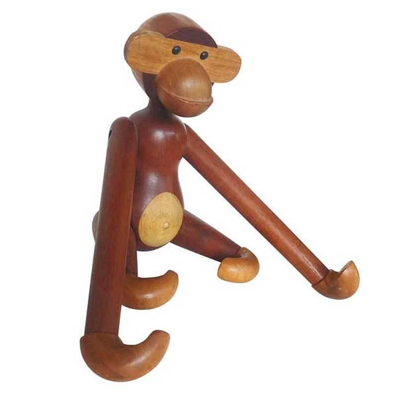 A delightfully expressive and beautifully sculpted articulated teak and limba chimpanzee. This sculpture can easily be hung from it's feet or hangs. 

Branded 