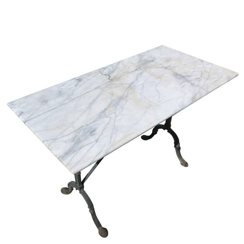 This fantastic example of late 19th century Provincial French furniture is as utilitarian as it is attractive. The intricate cabriole legs rendered in iron are connected by strapping in the same material supporting the white marble top. 

Because