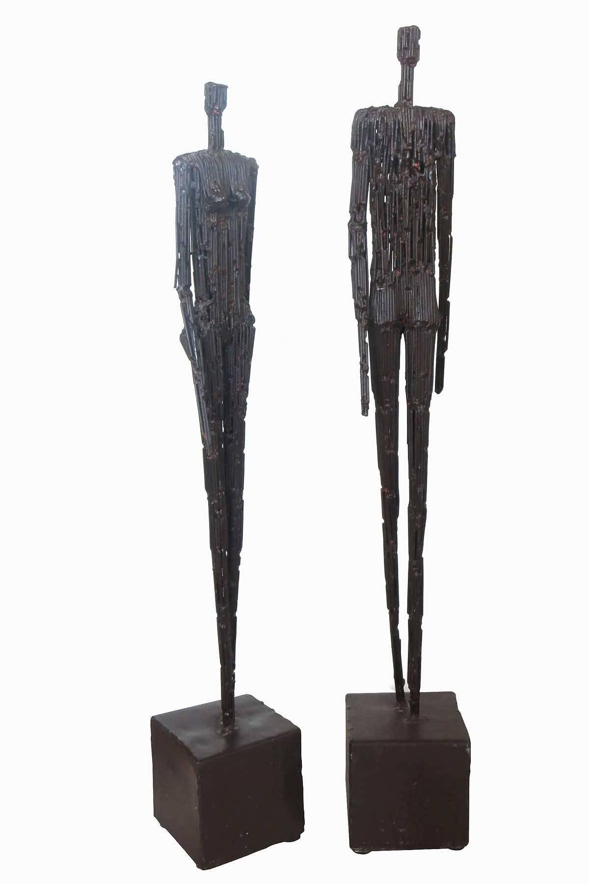 Pair of nail sculptures following the forms made famous by sculptor Alberto Giacometti.