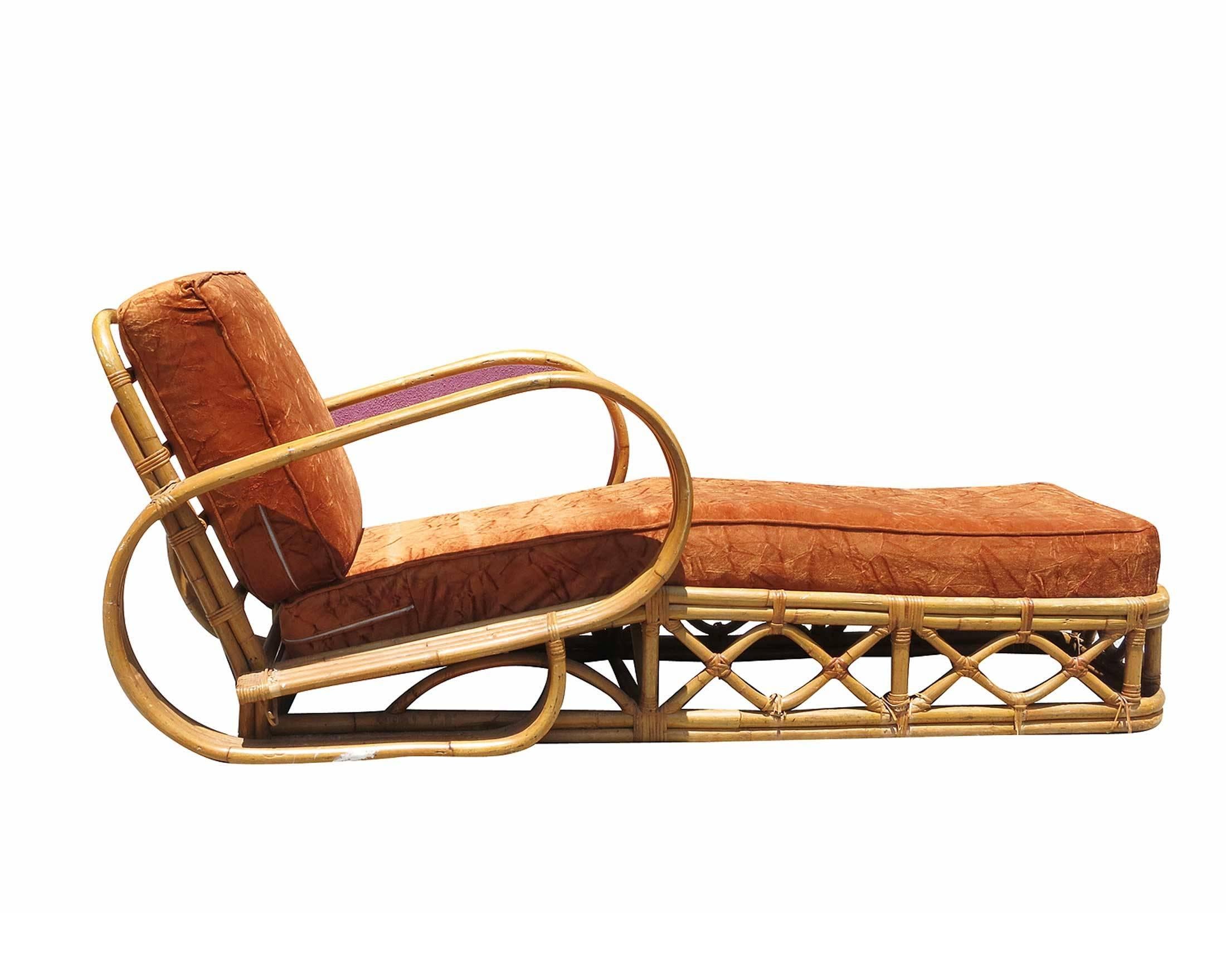 Rattan four-strand chaise longue with what we at the shop call the "Speed" arm. 

Inspired by Paul Frankl this lounge is one of the rarest of all designs. The workmanship is superior to most rattan out there and this can easily be seen in