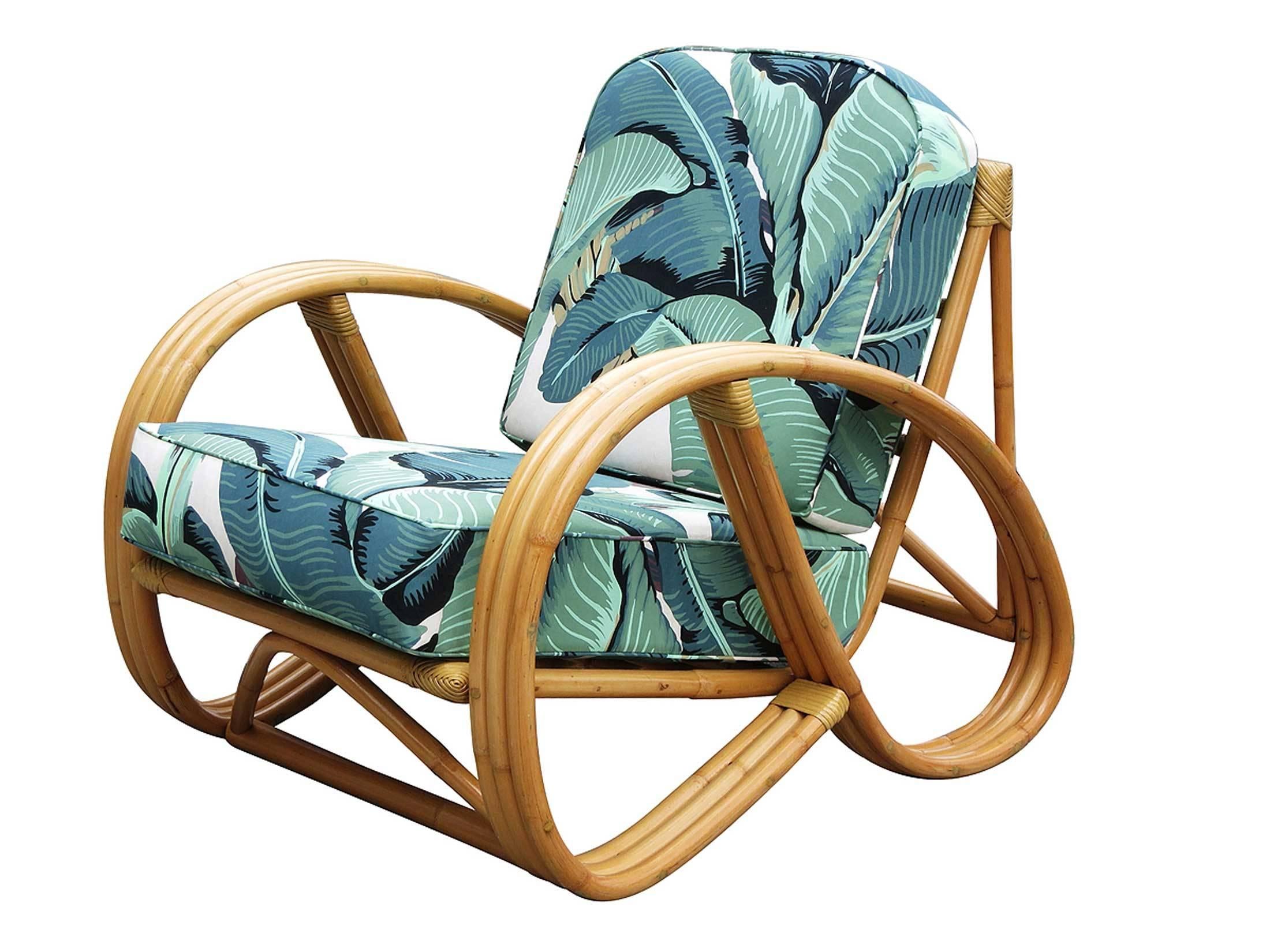 This round 3/4 pretzel arm rattan lounge chair.

This arm chair dates from the 1940s with optional "Martinique Banana Leaf" cushions featuring hand screened/painted Martinique fabric by the original manufacture in Los Angeles.

This