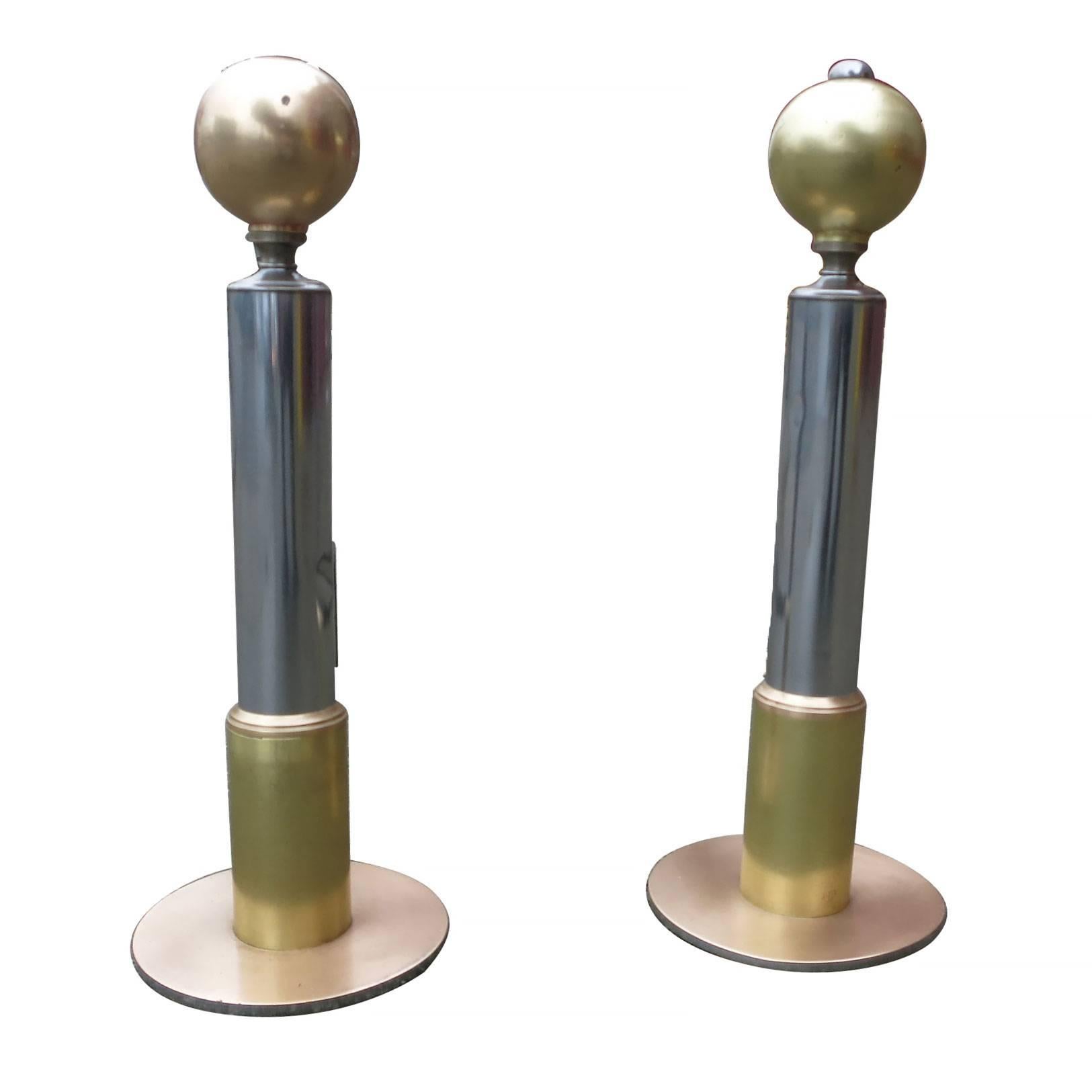 This American Art Deco chrome and brass andirons set that has been restored to original shine. The andirons feature a 5