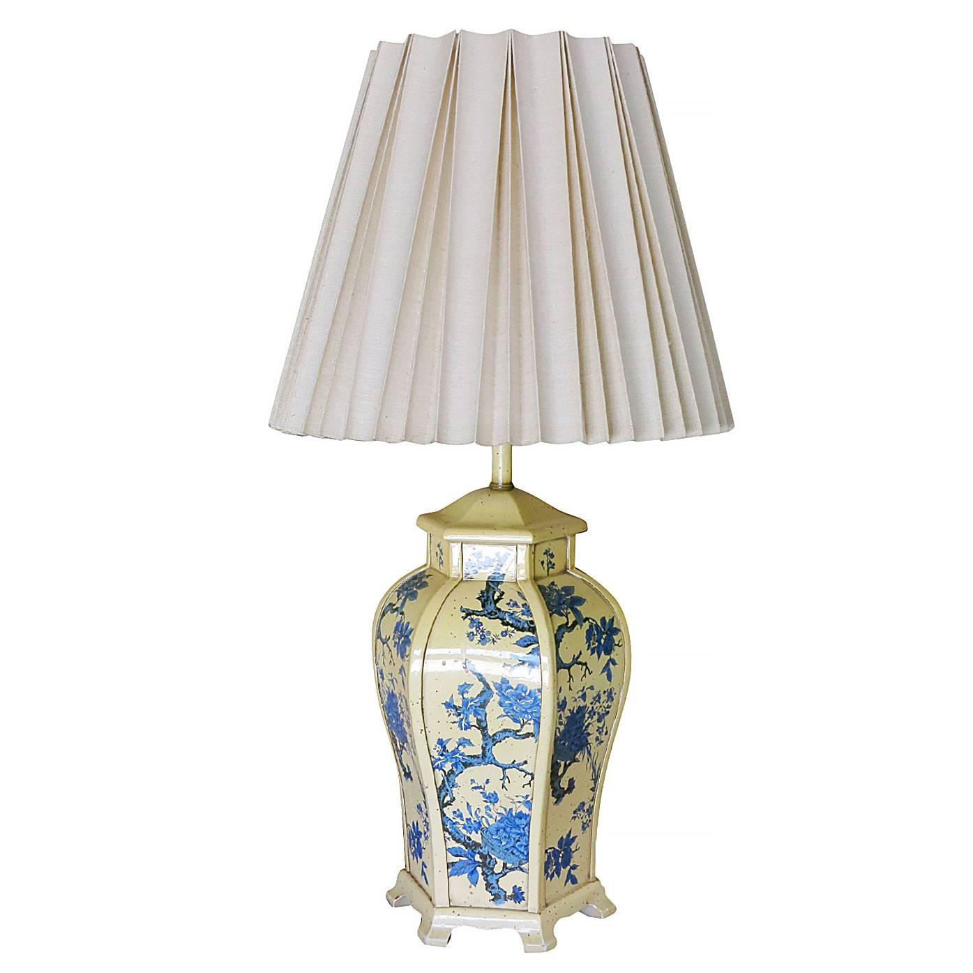 James Mont style metal lamp pair with Asian inspired enamel finish featuring a floral like design of a Bonsai with a cream color background. 

With a mix of modernist design and classical Asian murals this lamp is sure to work in a variety of