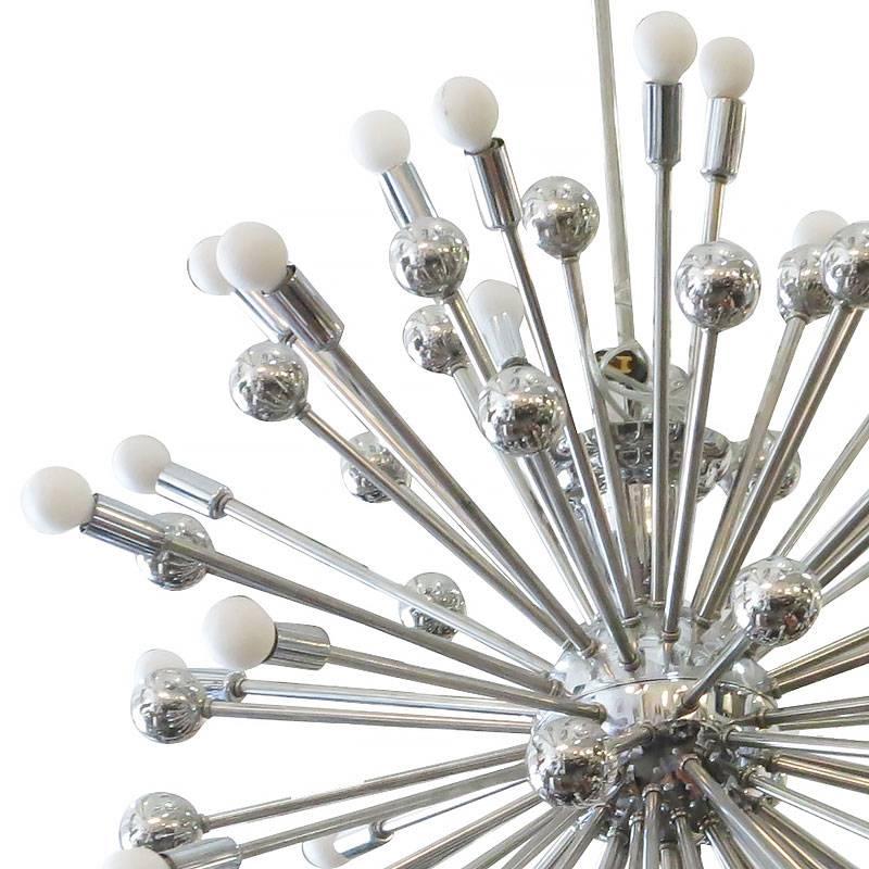 Large Mid-Century Modern style Sputnik chandelier consisting of over 80 chrome rods that extend from its chromed steel centre point with a chrome balls and light sockets.

It is suspended from a chromed steel dome canopy and rod. It has been newly