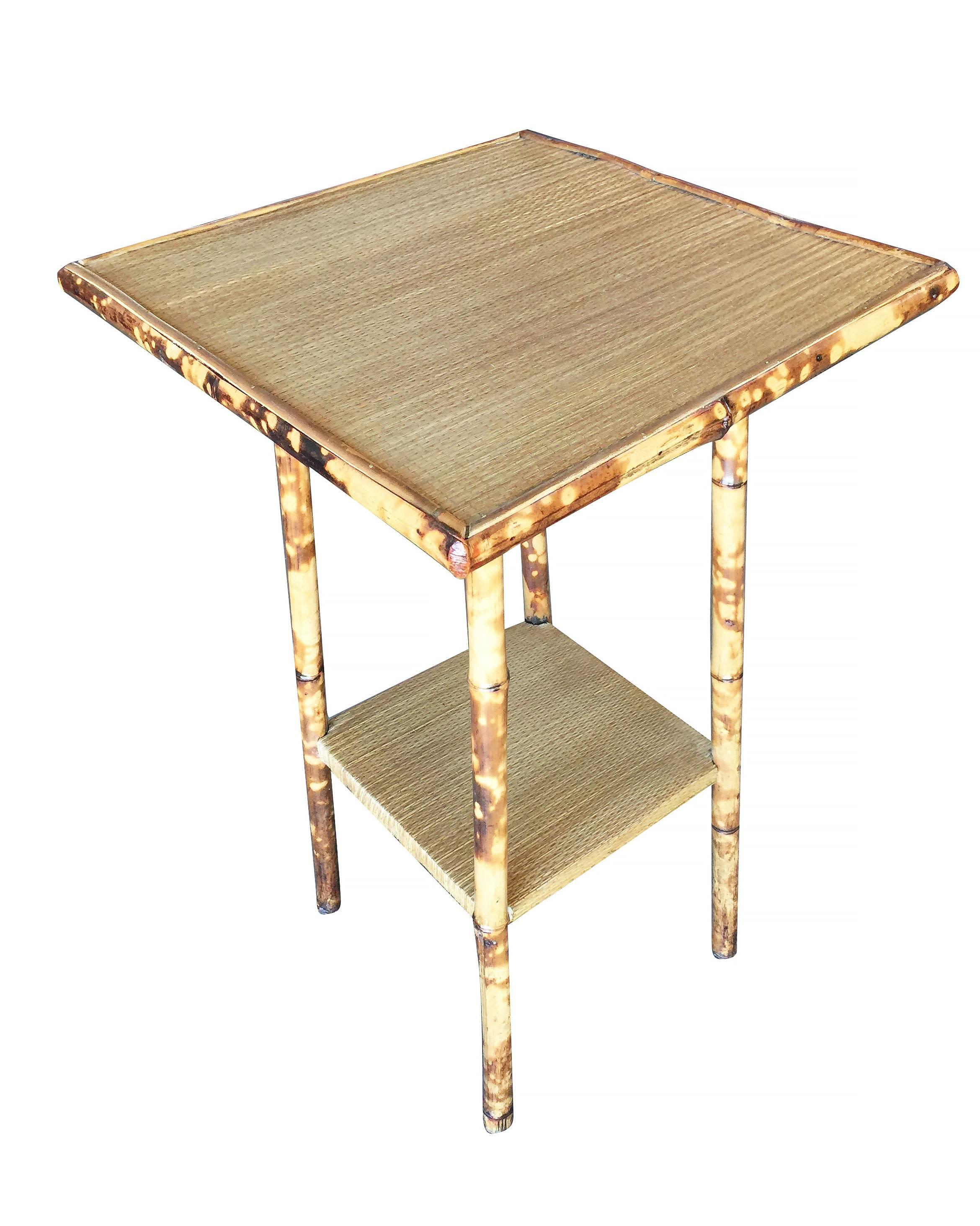 Antique tiger bamboo straight legs pedestal side table with rice mat top and secondary bottom shelf.


Restored to new for you.

All rattan, bamboo and wicker furniture has been painstakingly refurbished to the highest standards with the best