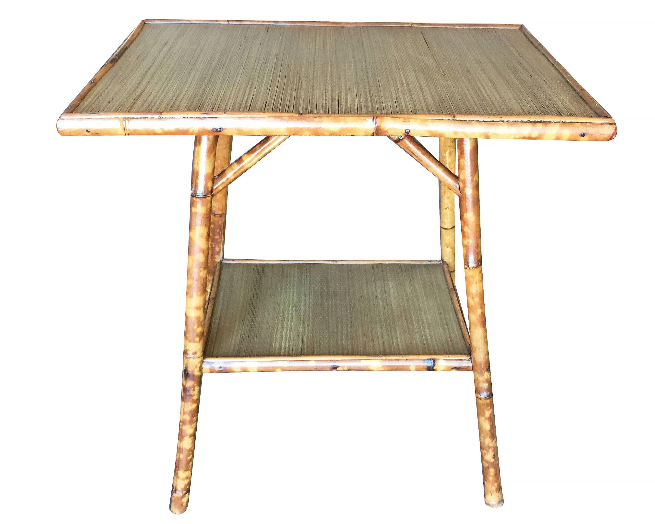 Antique Ascetically Movement tiger bamboo pedestal side table with rice mat top and secondary bottom shelf.

Restored to new for you.

All rattan, bamboo and wicker furniture has been painstakingly refurbished to the highest standards with the best