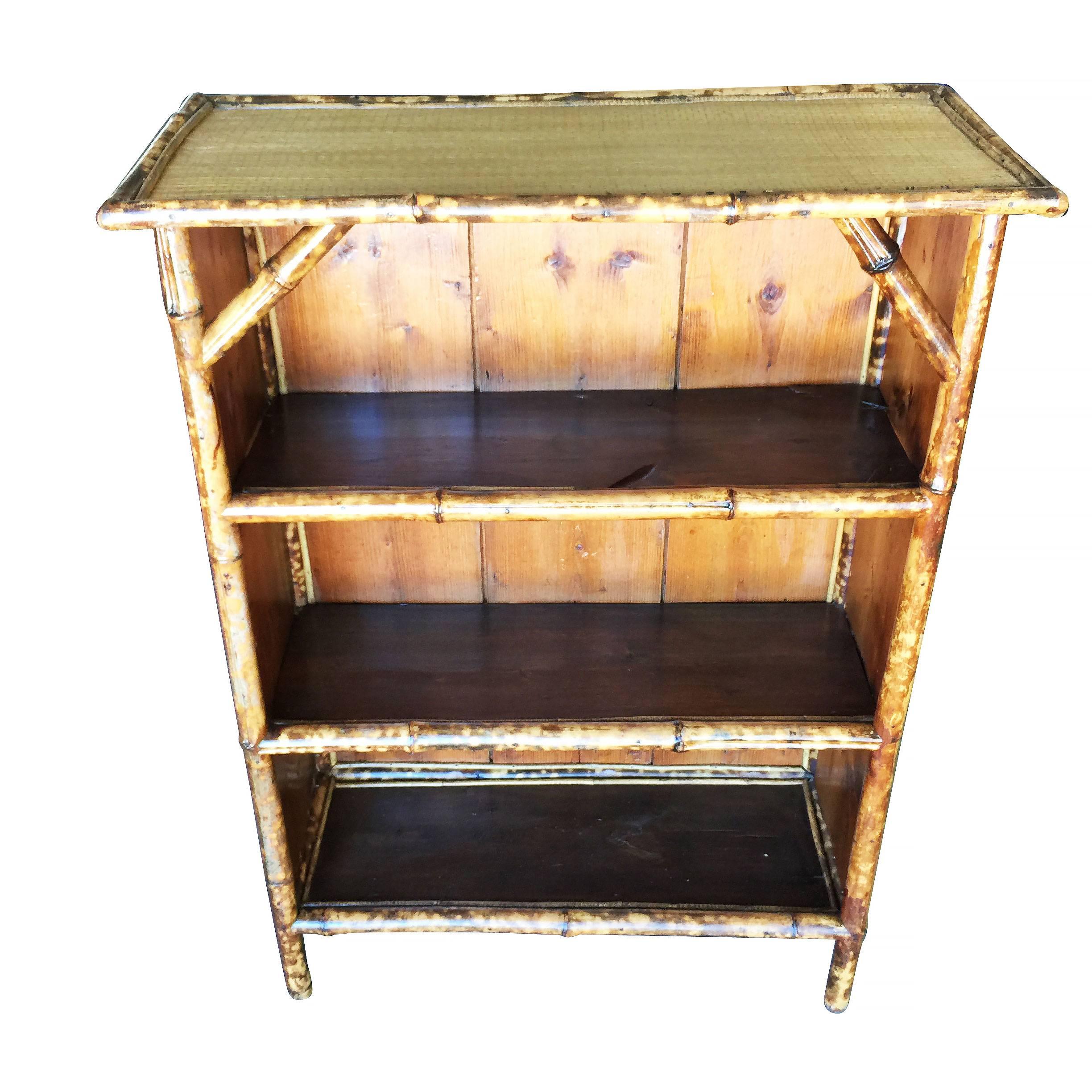 Antique four-level tiger bamboo shelf with hand weaved rice coverings and wood shelving.


Restored to new for you.

All rattan, bamboo and wicker furniture has been painstakingly refurbished to the highest standards with the best materials. All