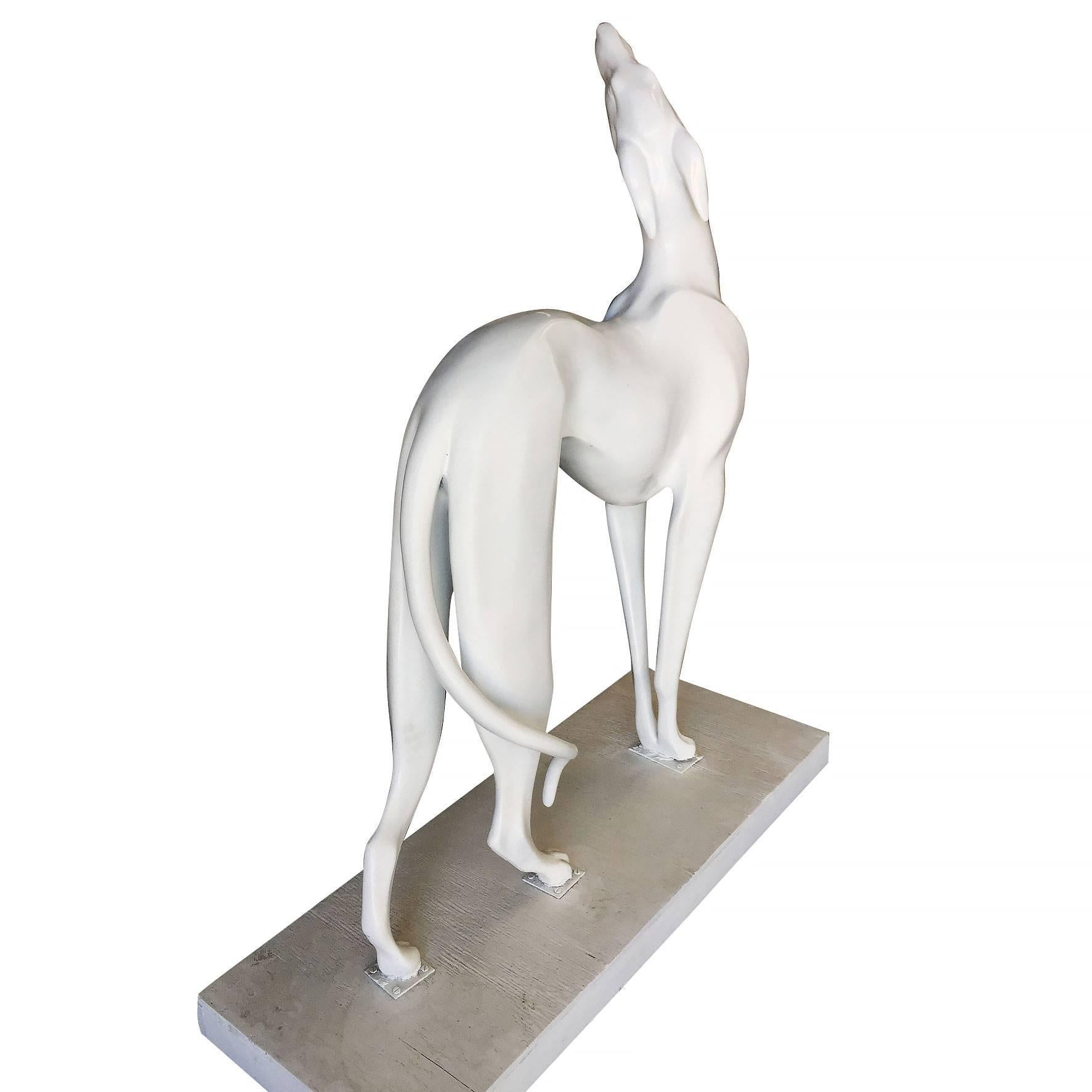 Life-sized Art Deco style greyhound figural statue for indoor and outdoor use.

The famous big white dog in Chandler and Joey’s apartment actually belonged to Jennifer Aniston. A friend gave it to her as a good-luck gift when she secured the role.
