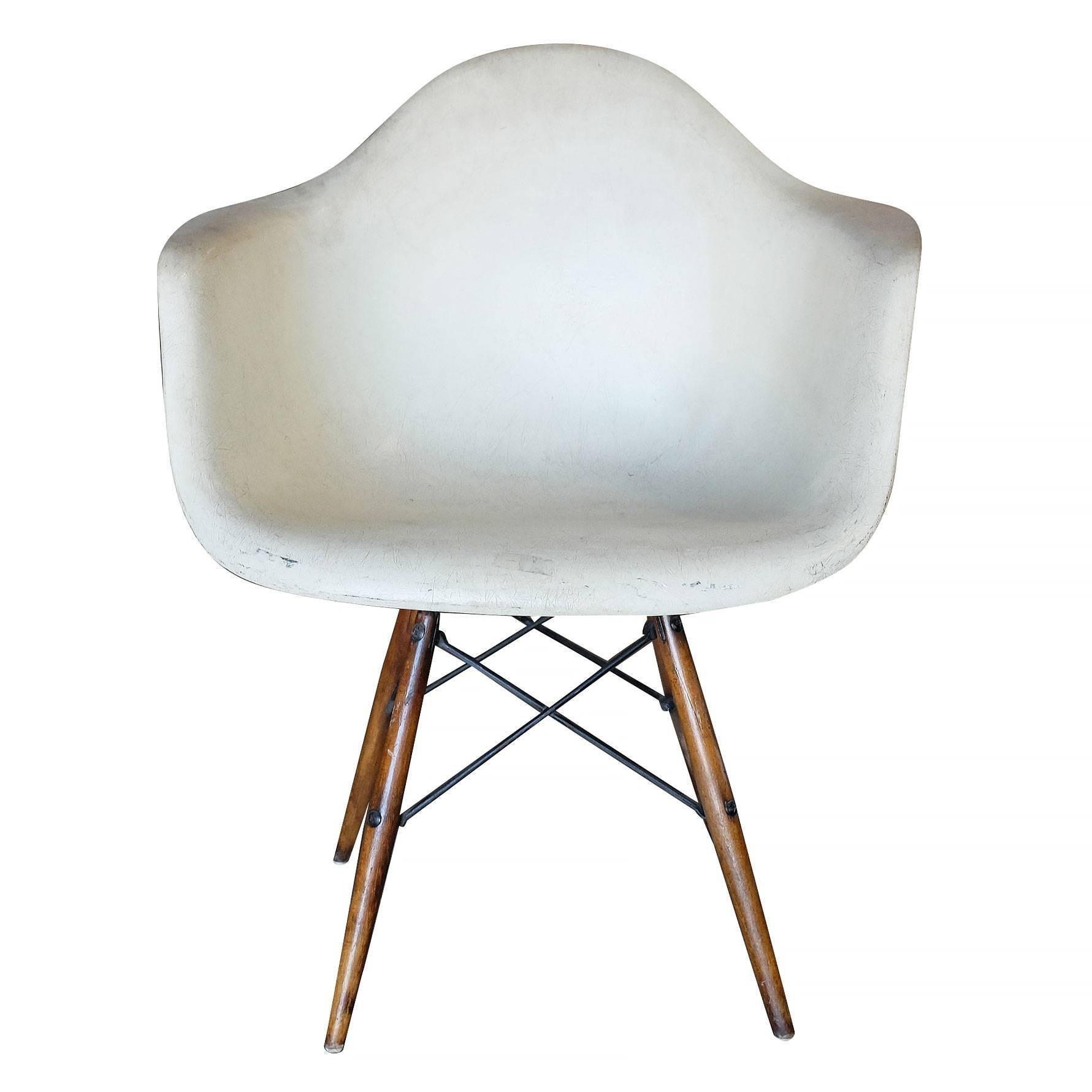 Molded fiberglass armchair with dowel base designed by Charles and Ray Eames for the Herman Miller Company. 

Signed 