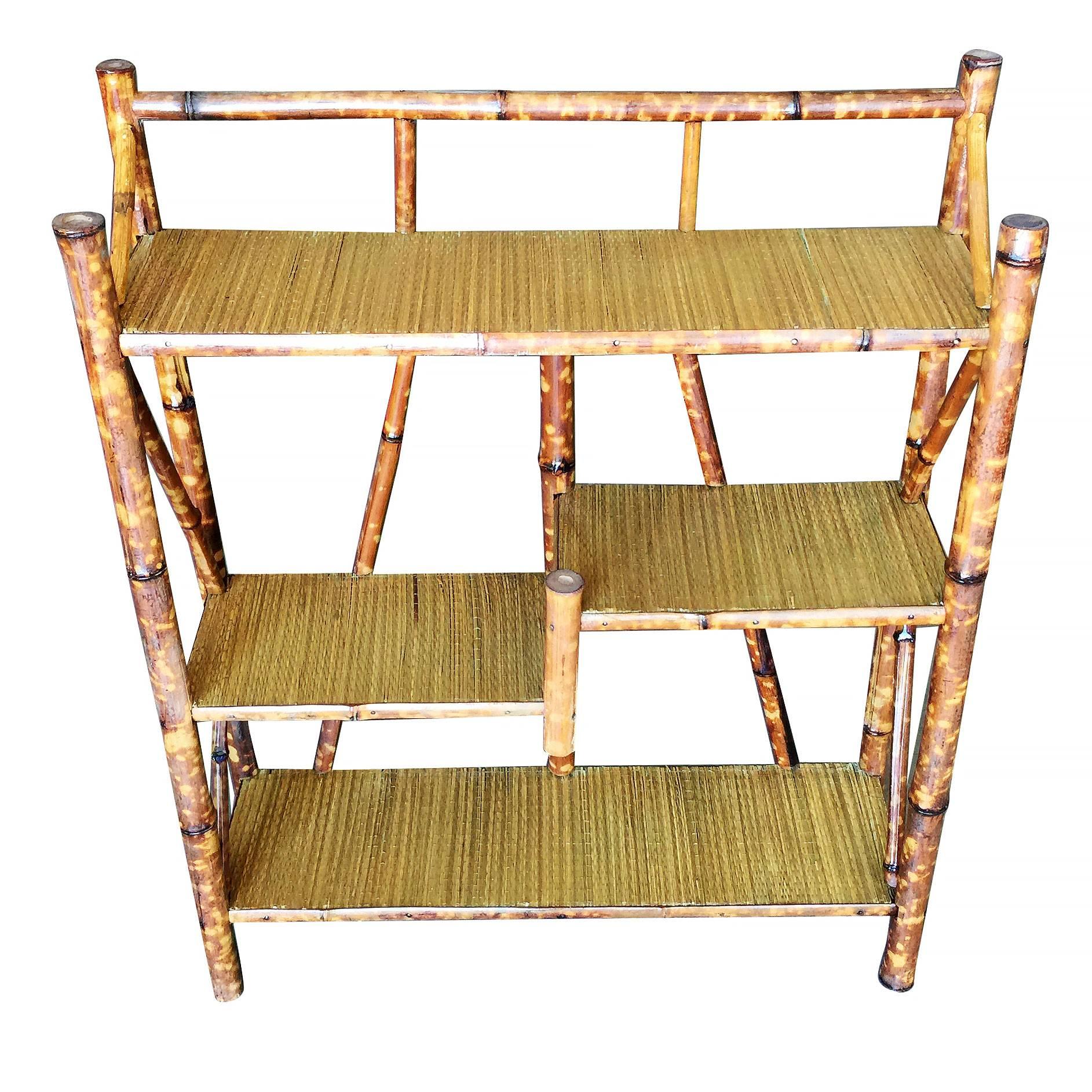 Antique four-tier tiger bamboo shelf or rack with rice mat top.

Refinished to new for you.

Restored to new for you.

All rattan, bamboo and wicker furniture has been painstakingly refurbished to the highest standards with the best materials. All