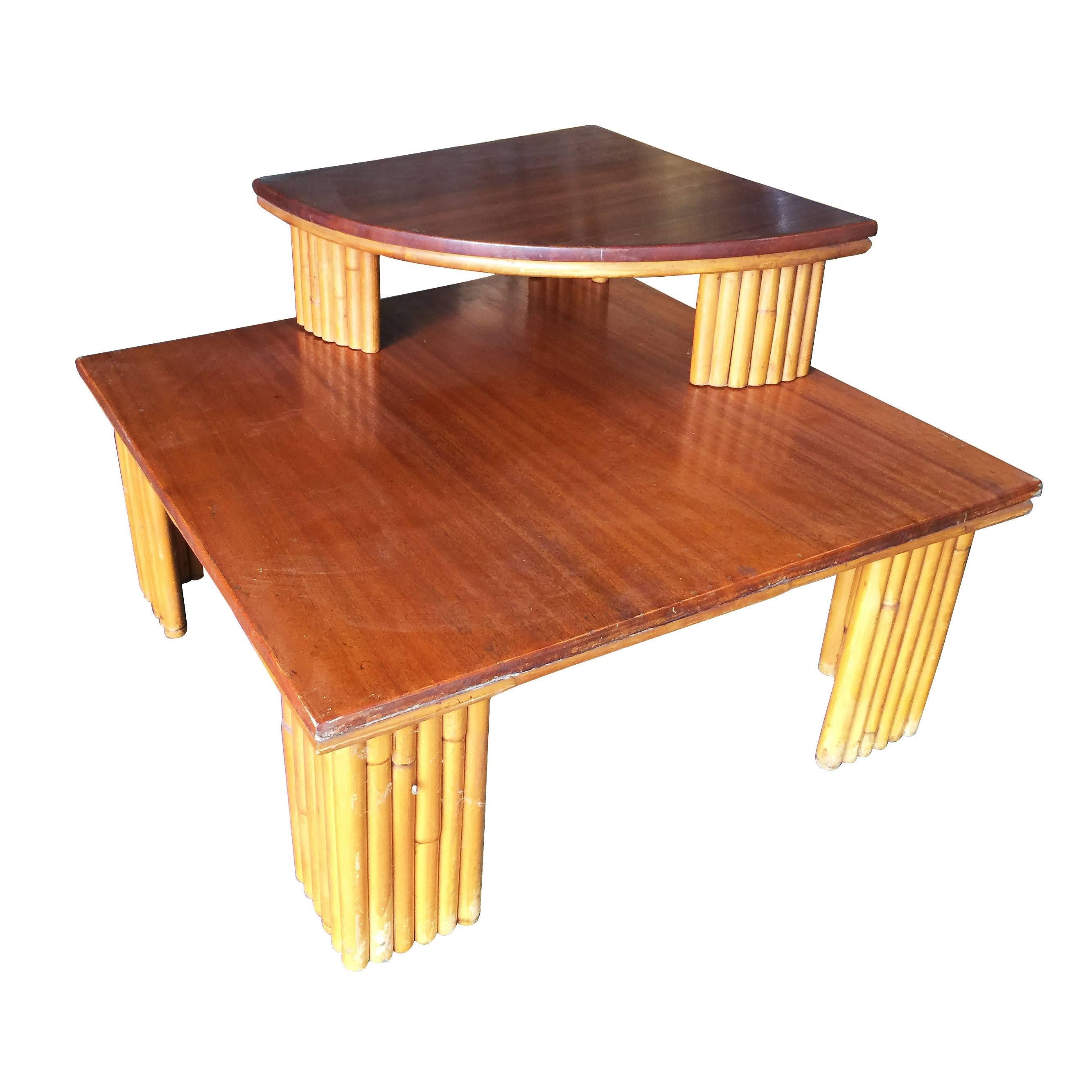 Vintage Pole rattan leg two-tier corner side table with mahogany top. The second tier is removable and can be placed anywhere on the table. 

Measure: Table 15.5