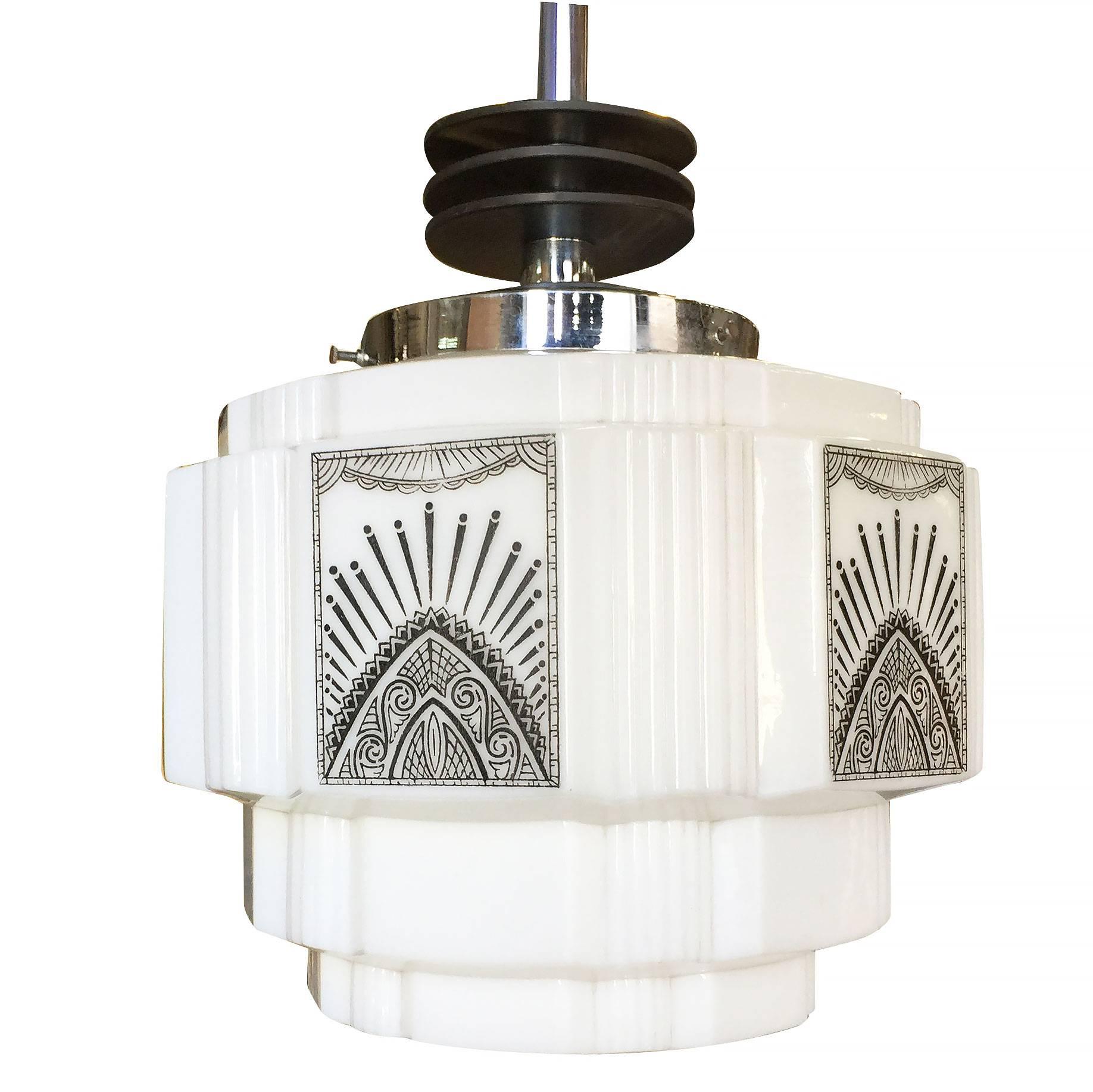 Rare Art Deco chrome ceiling pendant with enameled black streamline accents and stepped milk glass geometric schoolhouse style globe with hand-painted Art Deco design.