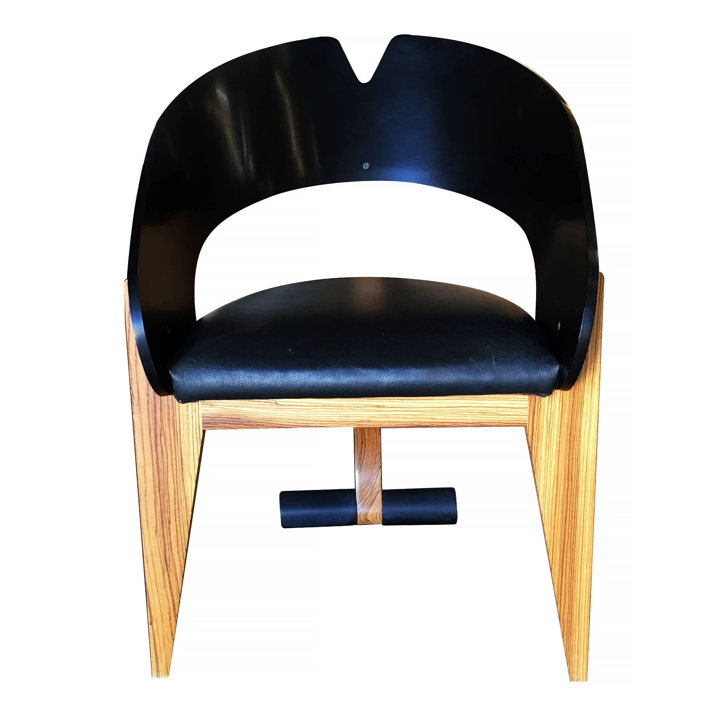Modernist chair from the Gallery of Functional Art, circa 1990 featuring a black lacquer seat back with leather seat bottom and blonde zebrawood legs.

Available three.