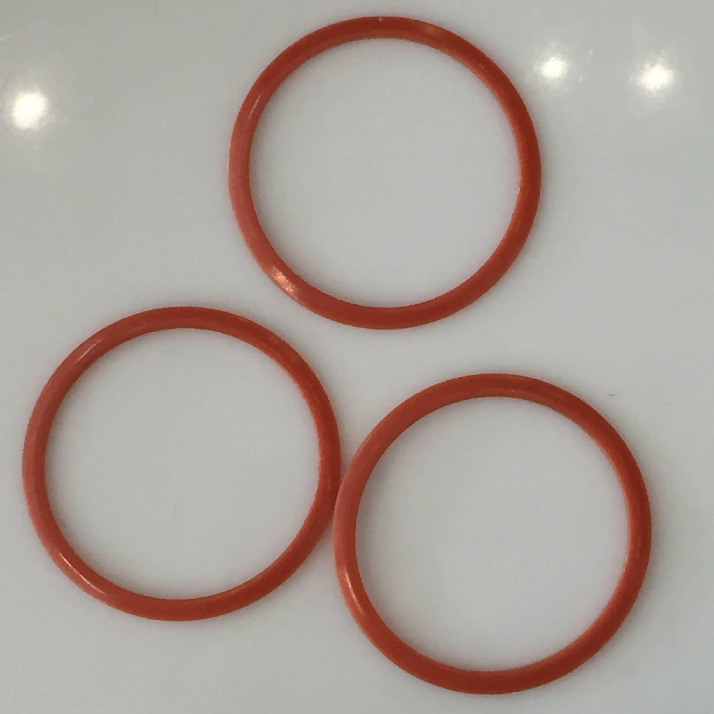 Mid-Century Modern Lot of Three Tangerine Celluloid Bakelite Bangles Bracelets