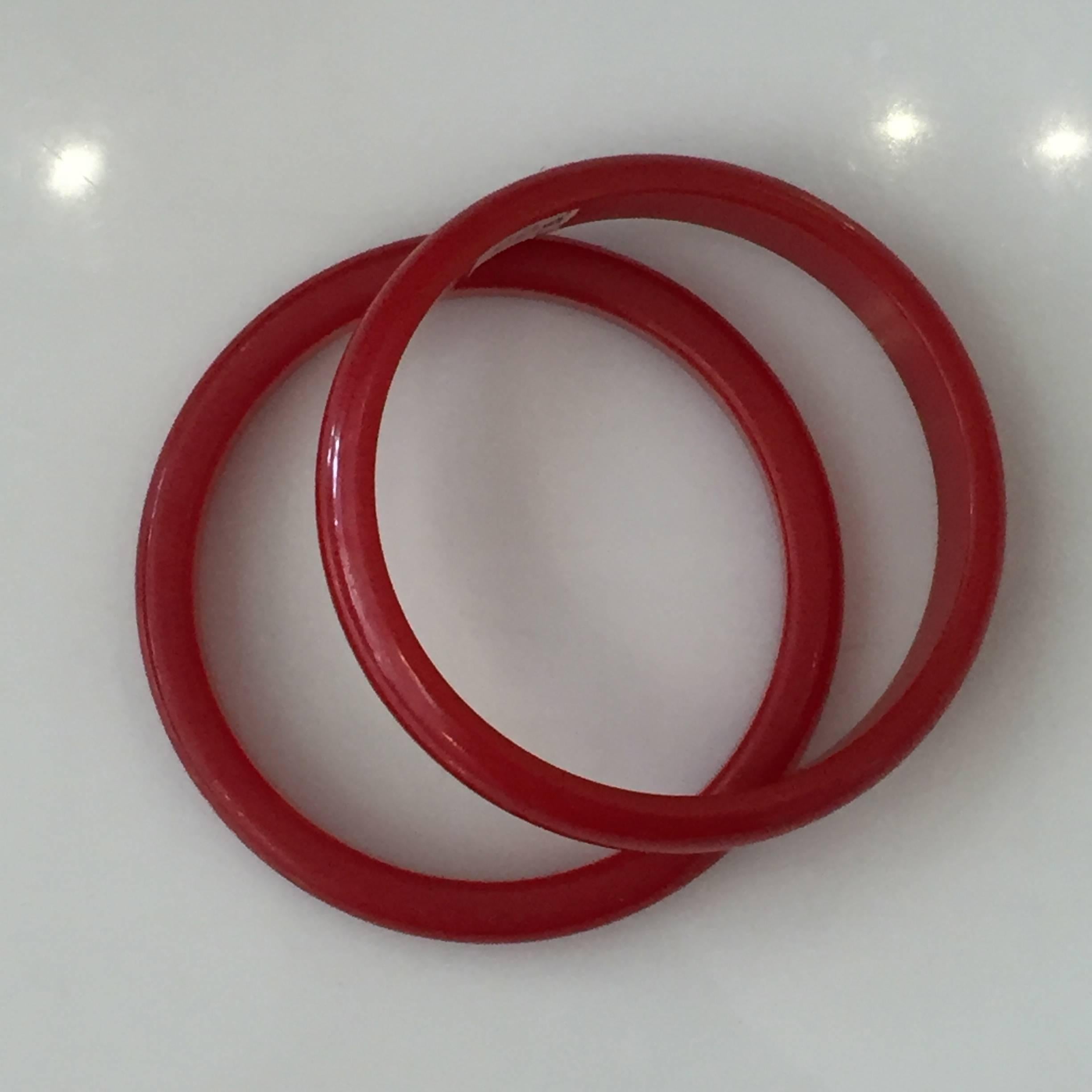 Set of two brightly colored cherry red bakelite bangles bracelets. 

2 3/8