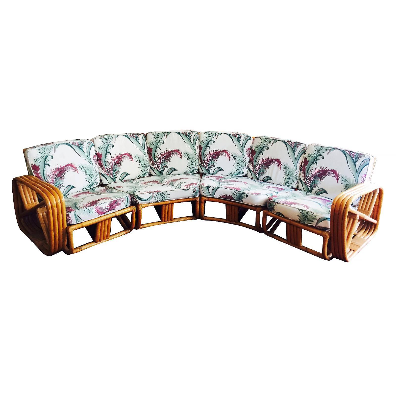 Four strand square pretzel Corner rattan sectional sofa . This sofa features a bent rattan base with four strand square pretzel arms and is divided into a four sectional, two end pieces that each fit one person each and two large double person