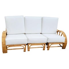 Restored 3 Strand Rattan 4 Spoke Halfmoon Arm 3 Seat Sofa