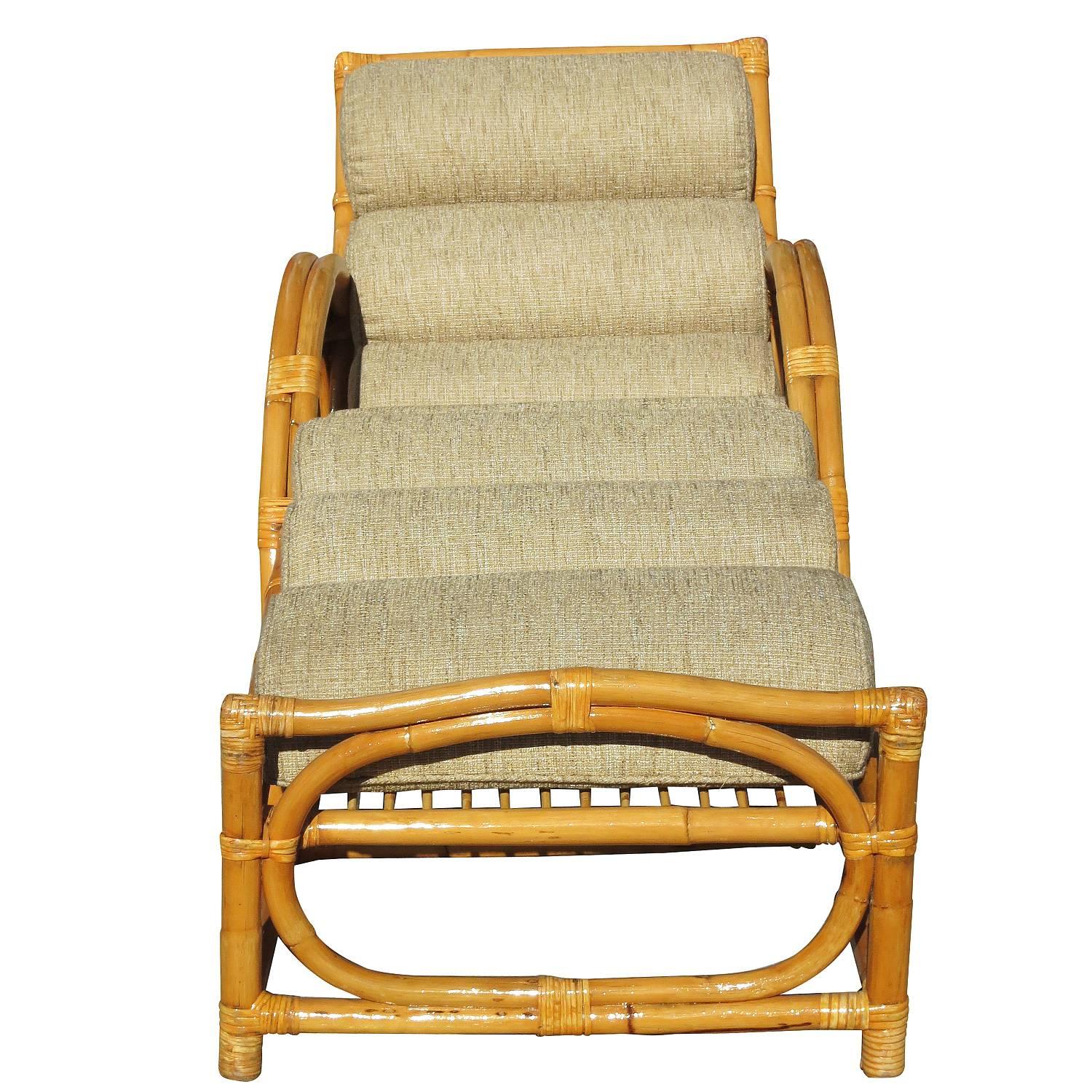 Rattan chaise lounge with what we at the shop call the Circles and Speed Arm, two strand side arms. Inspired by Paul Frankl this lounge is one of the rarest of all designs. The workmanship is superior to most rattan out there and this can easily be