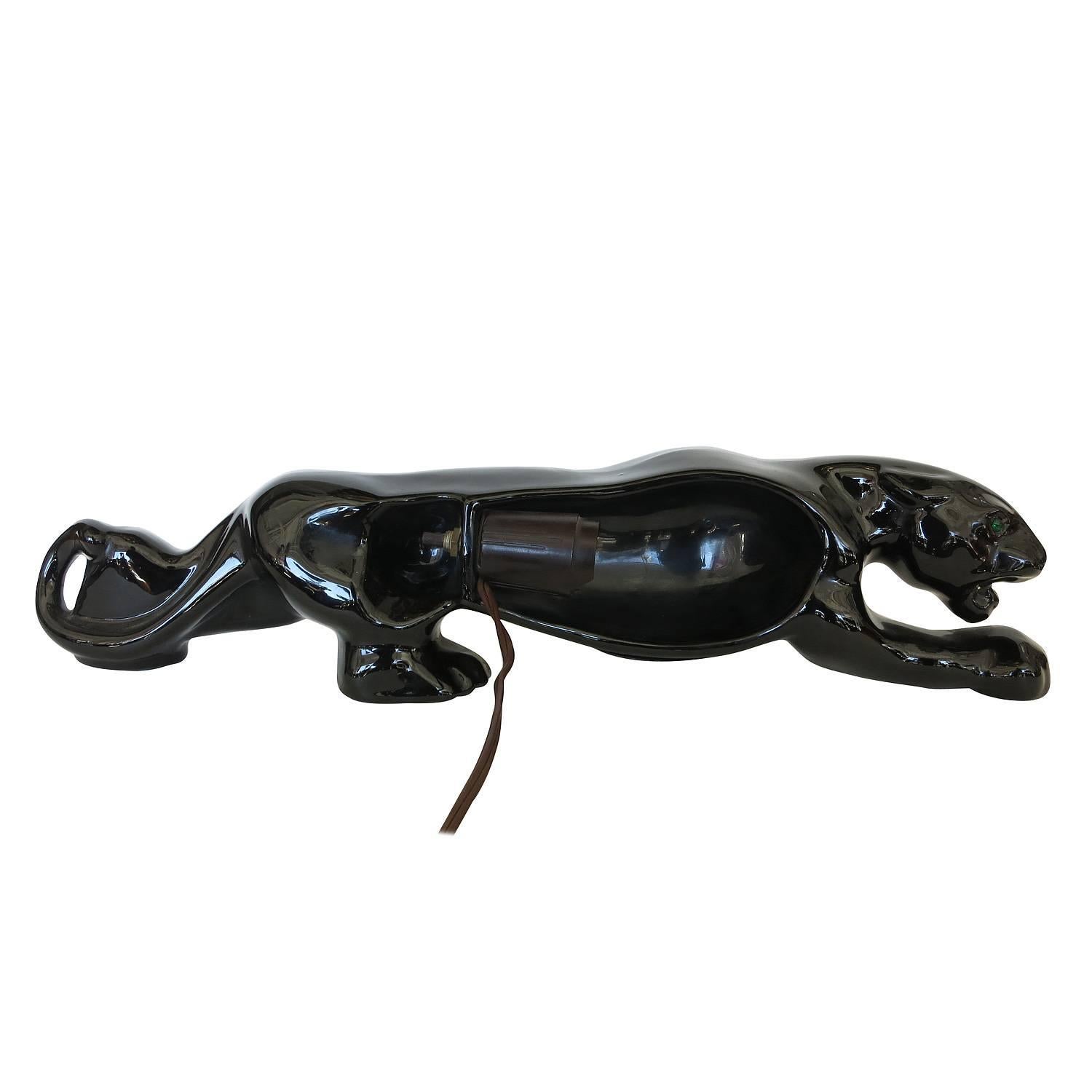 Dear Customer, I have marked many of my items for the 1stdibs Saturday Sale, take a look and save from 20% to 50% now. Take a look at all of these items; https://goo.gl/hNLz4x

Mid-Century black panther art pottery lamp featuring a high glazed black
