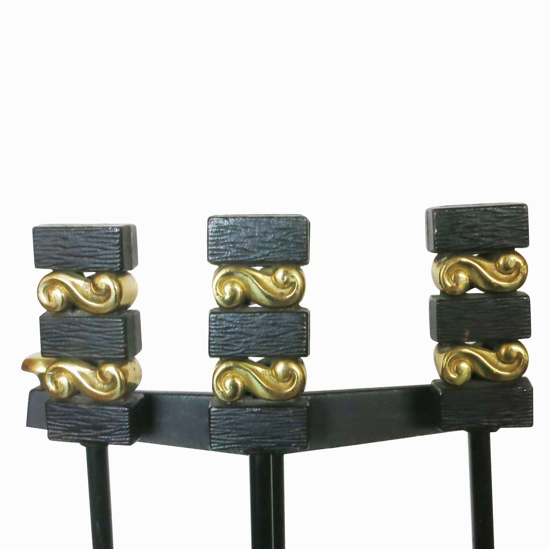 A set of modernist iron and brass Donald Deskey andirons and fireplace tools by the Bennett Co. 
This set includes stand, shovel, brush, pocker and set of two andirons. 
Fireplace tools on stand
32