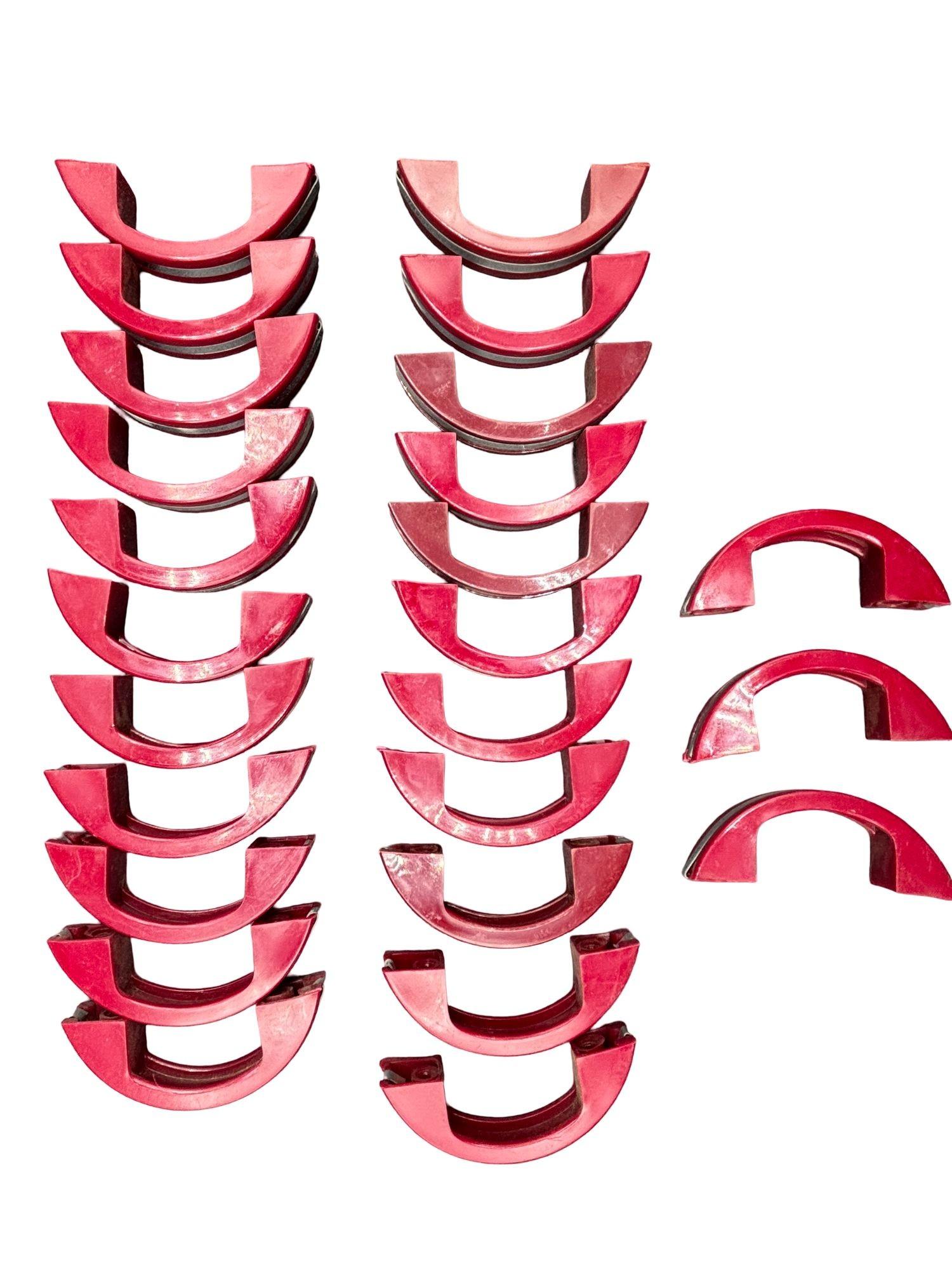 Set of 25 candy maroon red Catalin (colored Bakelite) drawer/door pull knobs each with a chrome strip down the center. Complete your period kitchen cabinetry with these classic Art Deco-era with a striking red color complemented by a sleek chrome